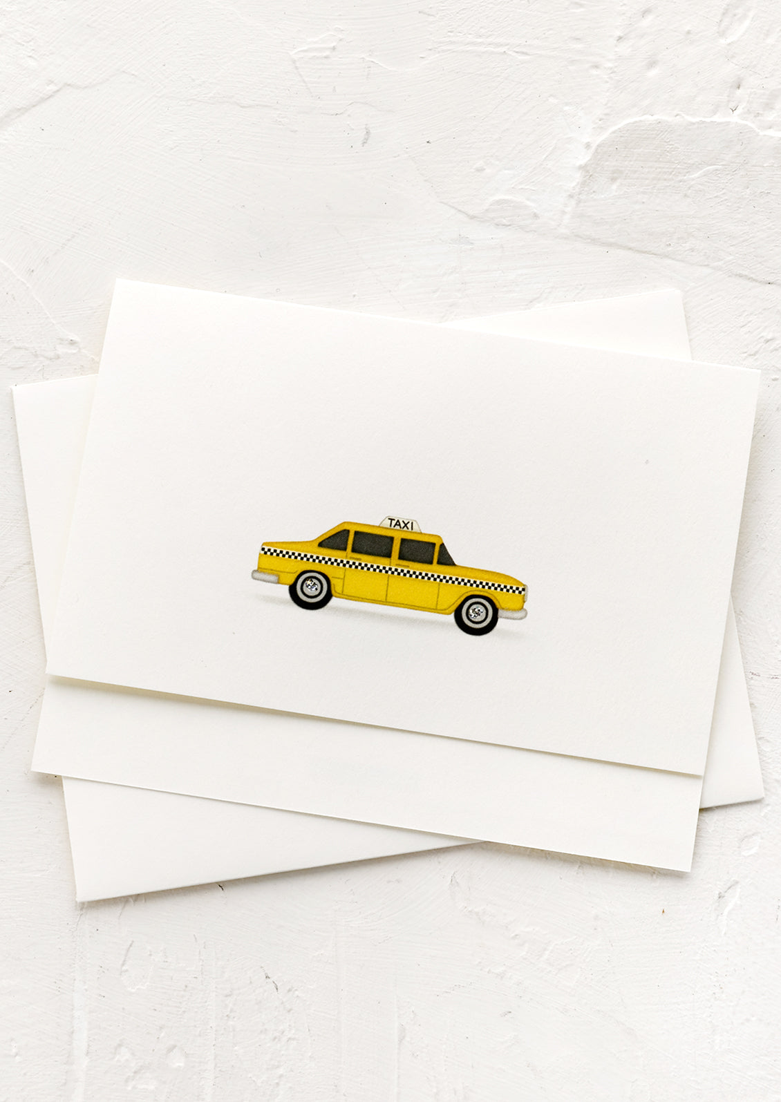 A card with illustration of NYC yellow cab.