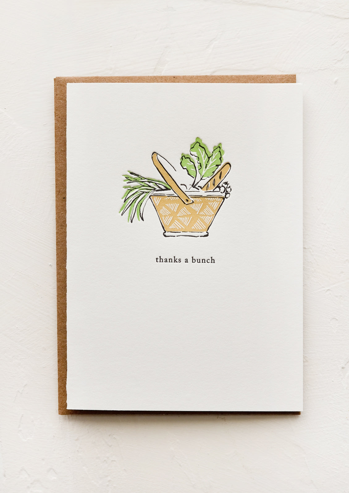 Greeting card with image of a picnic basket and text below "Thanks a bunch".