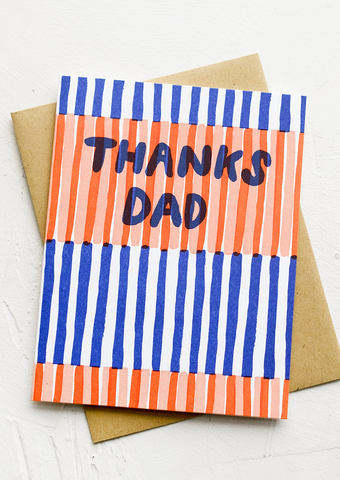 A striped greeting card with text reading "Thanks dad".