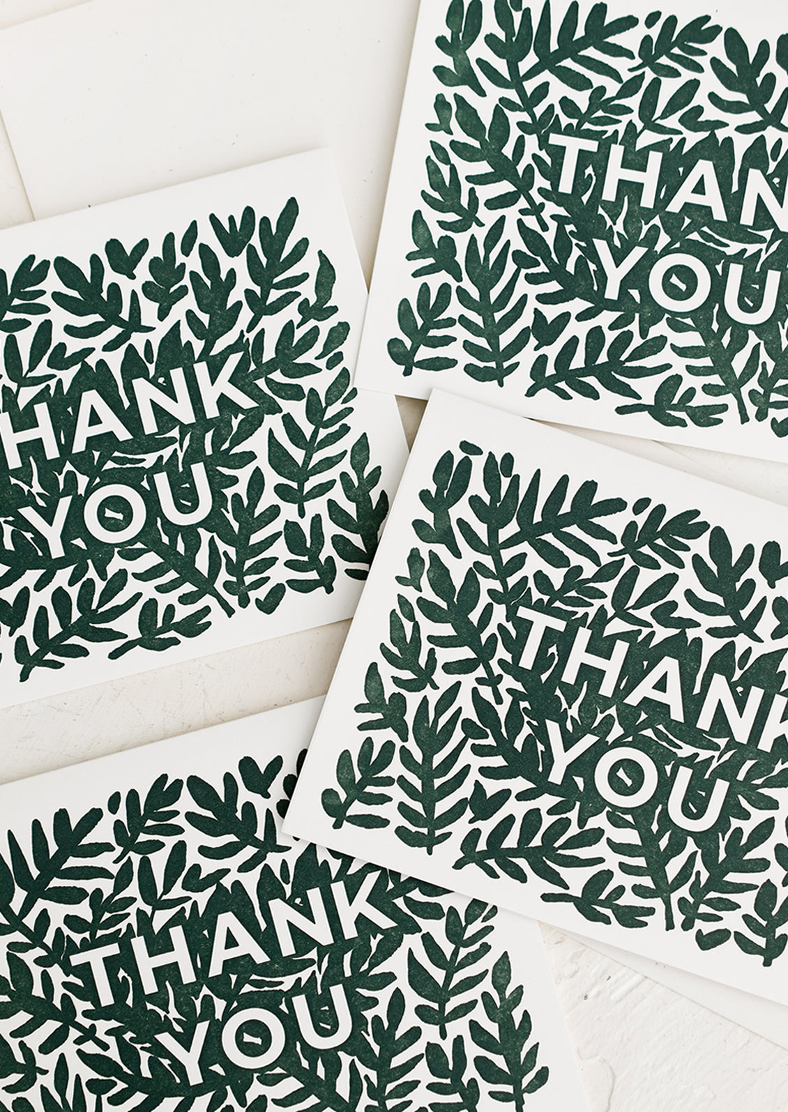 A set of greeting cards with green leaf print reading "Thank You".