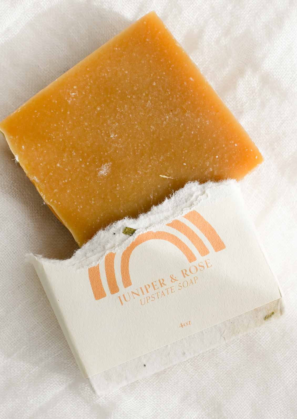 A bar of juniper and rose soap.