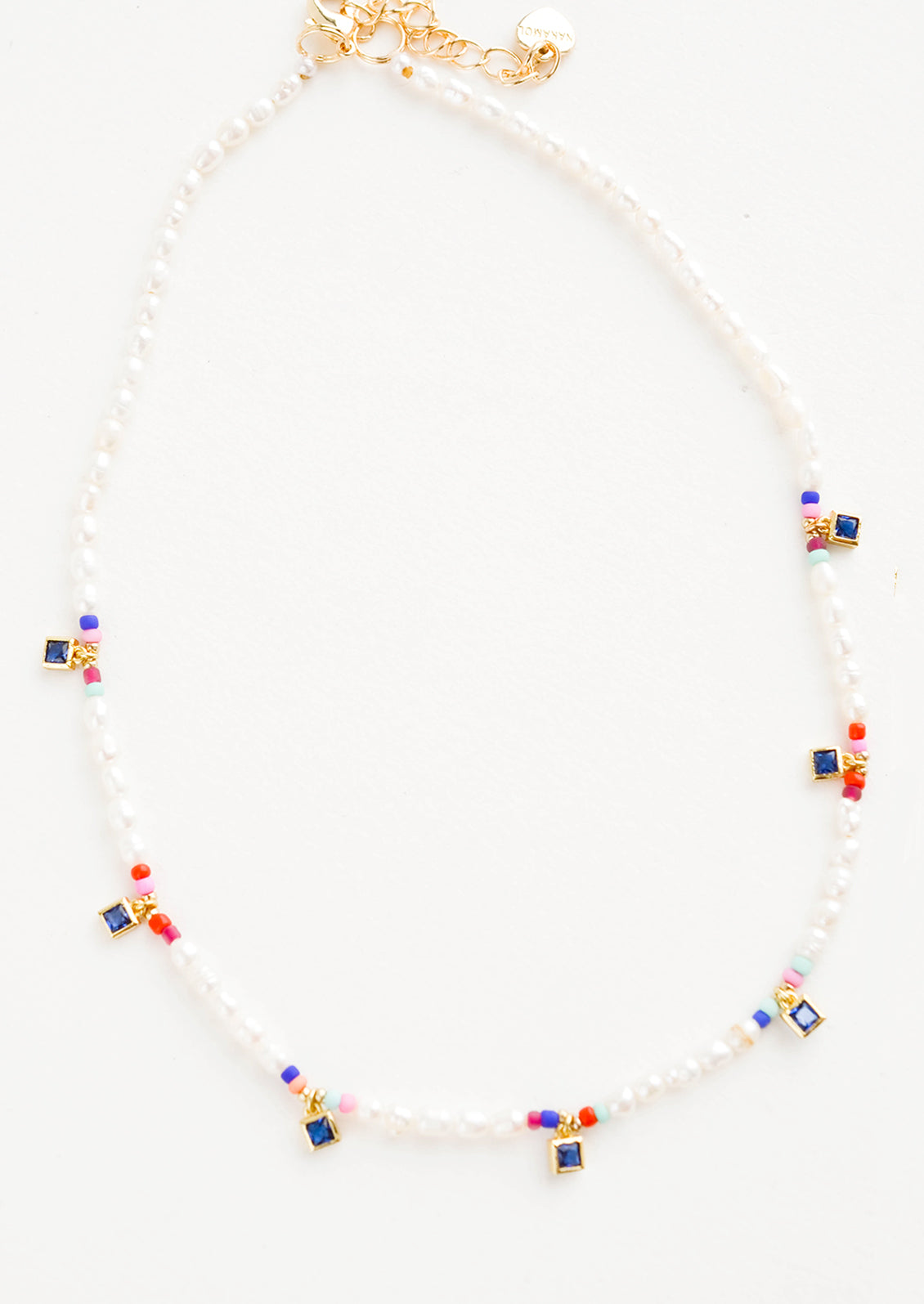 Beaded pearl necklace accented with square blue crystal stations and colored seed beads