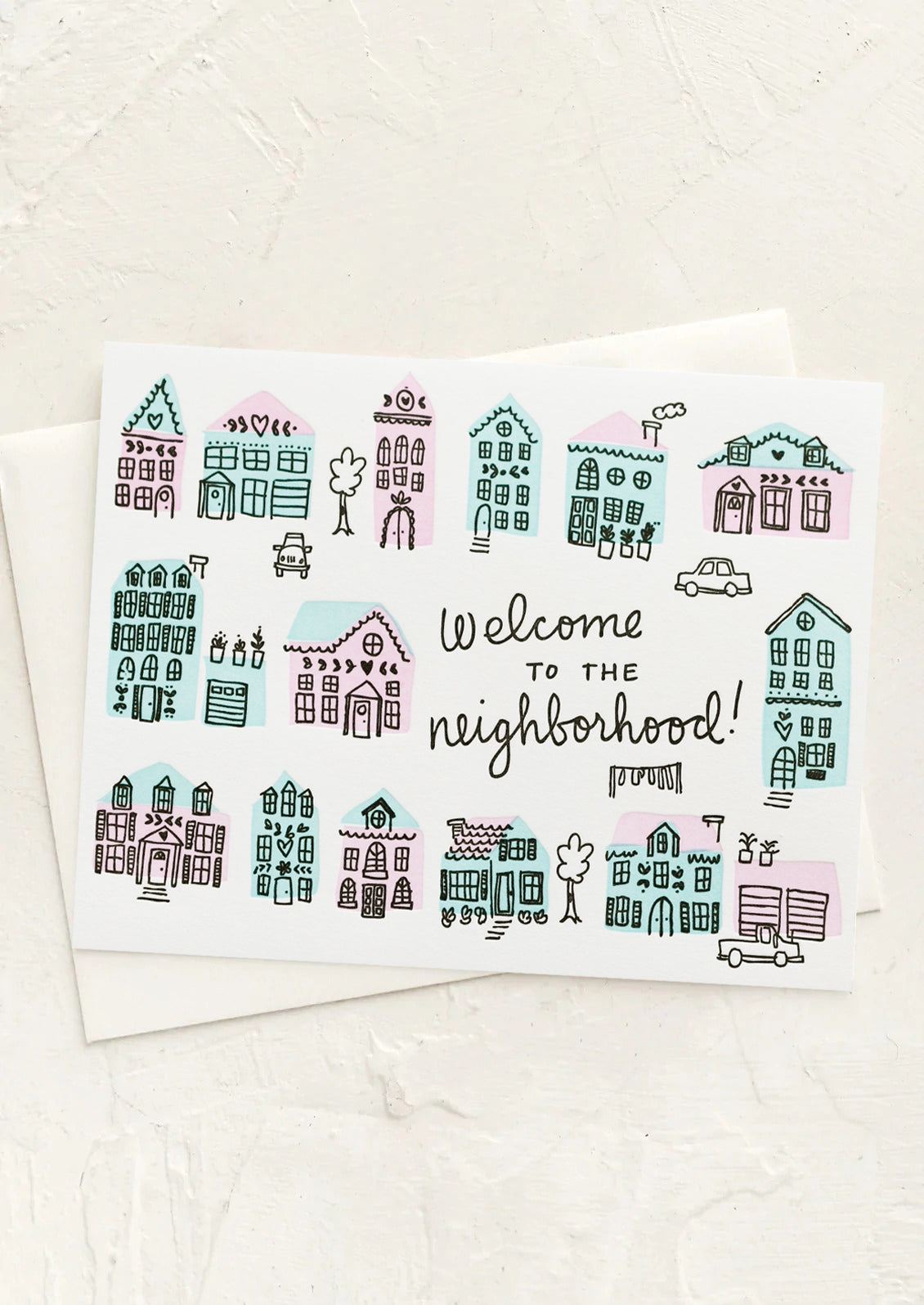 A card with illustrations of houses and text reading "Welcome to the neighborhood!".