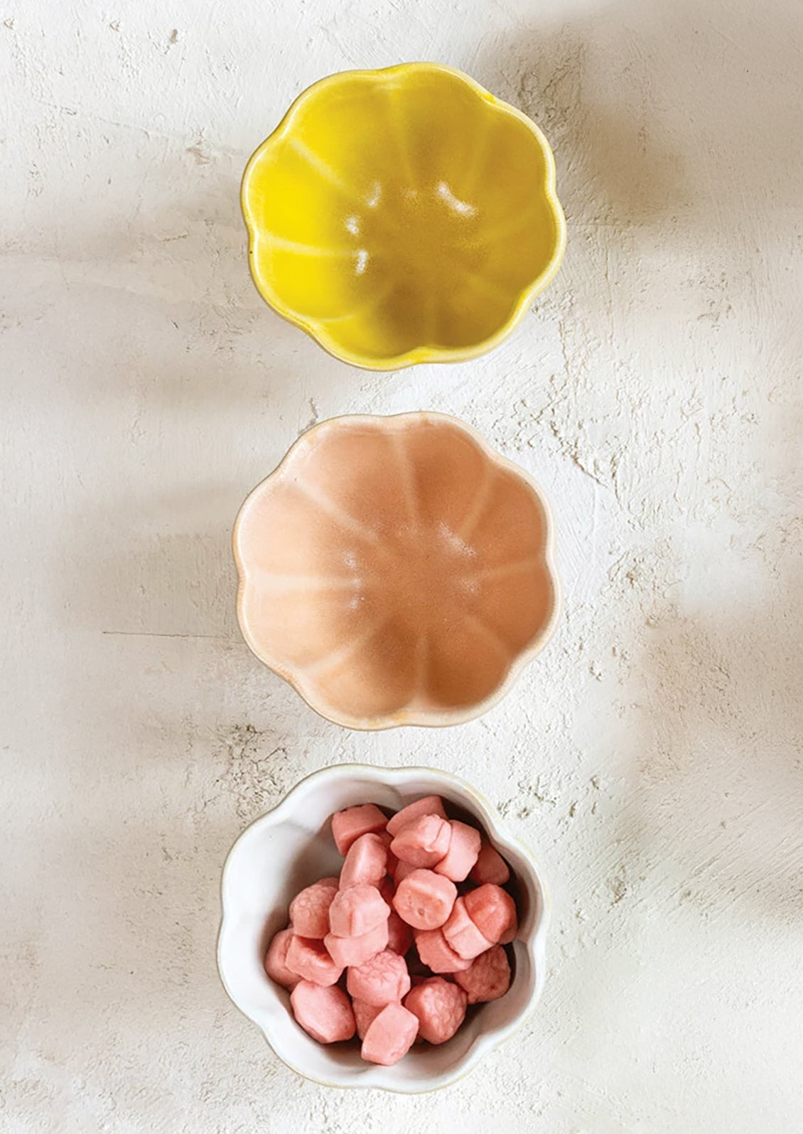 Ceramic snack bowls with scalloped shapes.