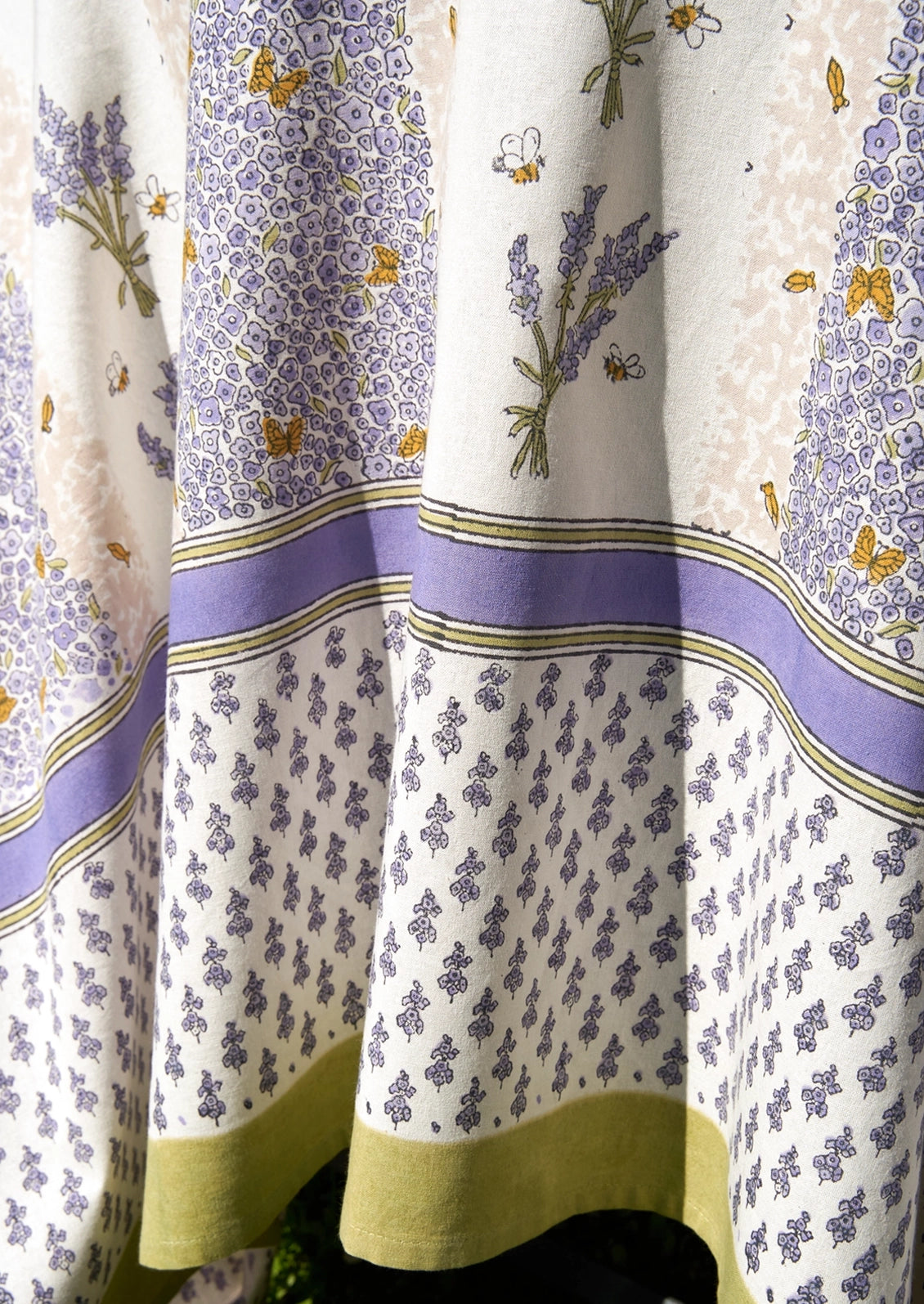 A tablecloth with lavender and bee print.