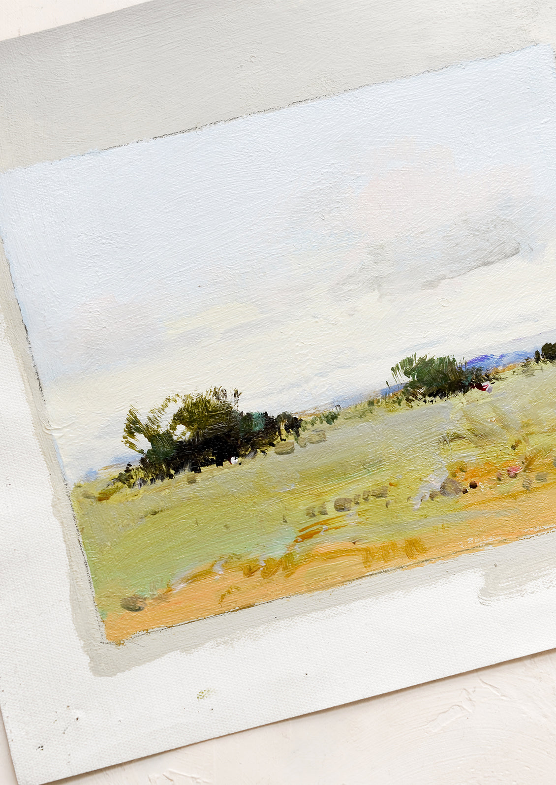 An original oil painting on unstretched canvas of landscape.