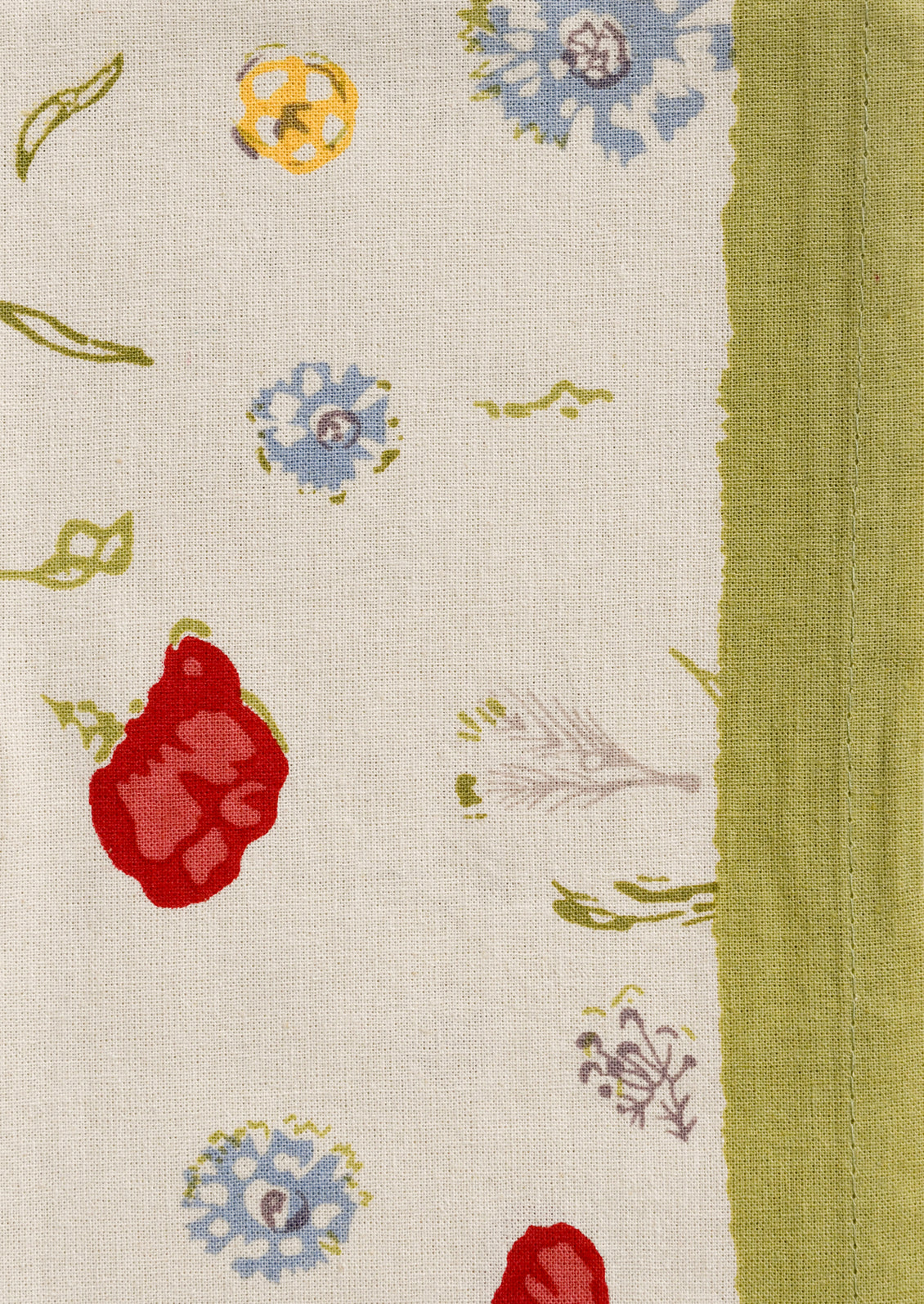 Textile with colorful floral and leaf patterns on a beige background