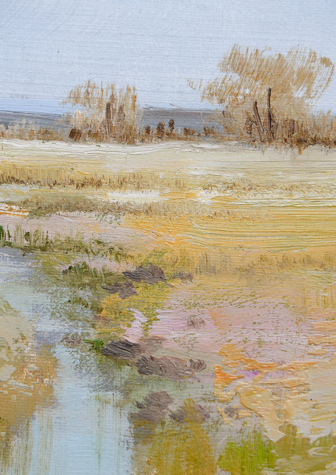 An original oil painting of a colorful meadow with blue stream running through it.