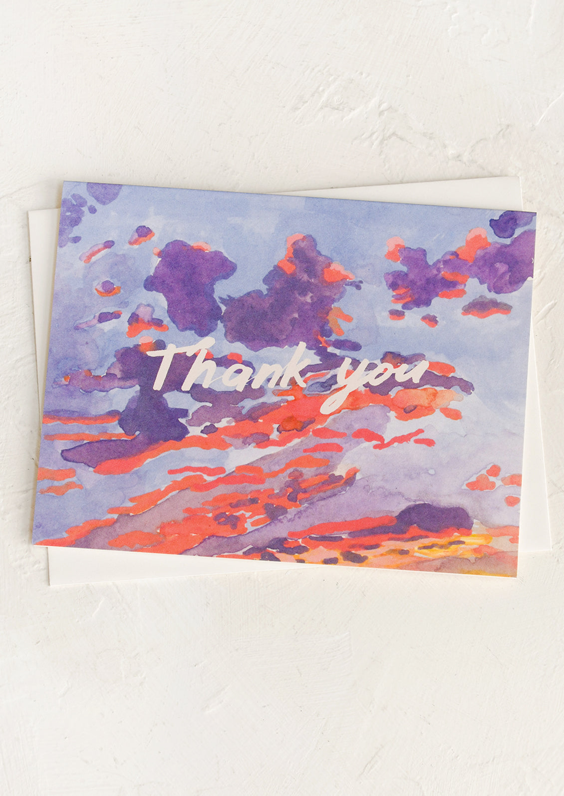 Greeting card with watercolor design and 'Thank you' text on a white background
