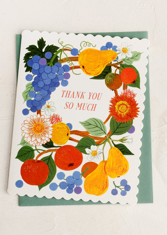 Greeting card with colorful fruit and floral design and 'Thank you so much' text.