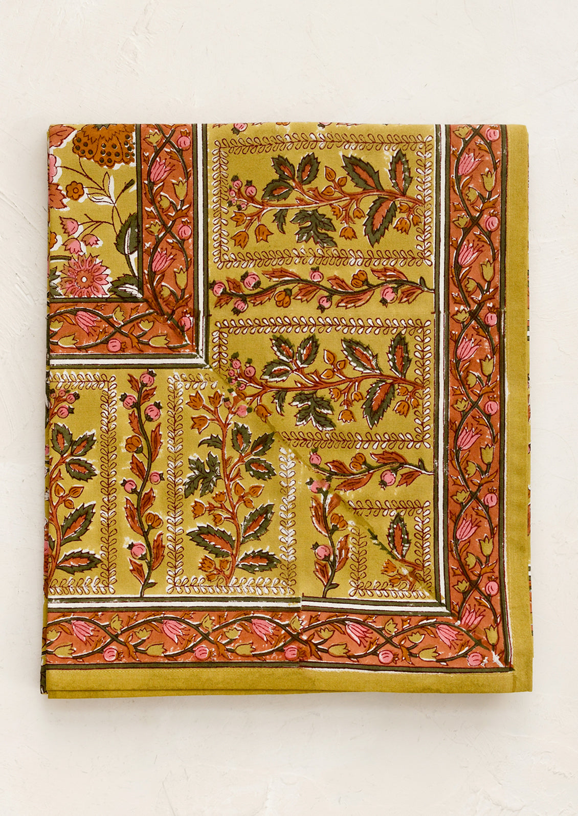 Decorative tablecloth with floral patterns.