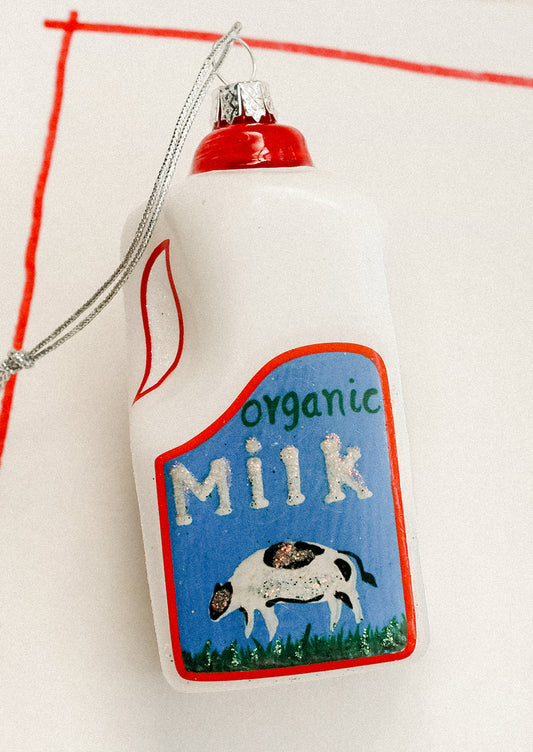 A holiday ornament depicting a carton of organic milk.