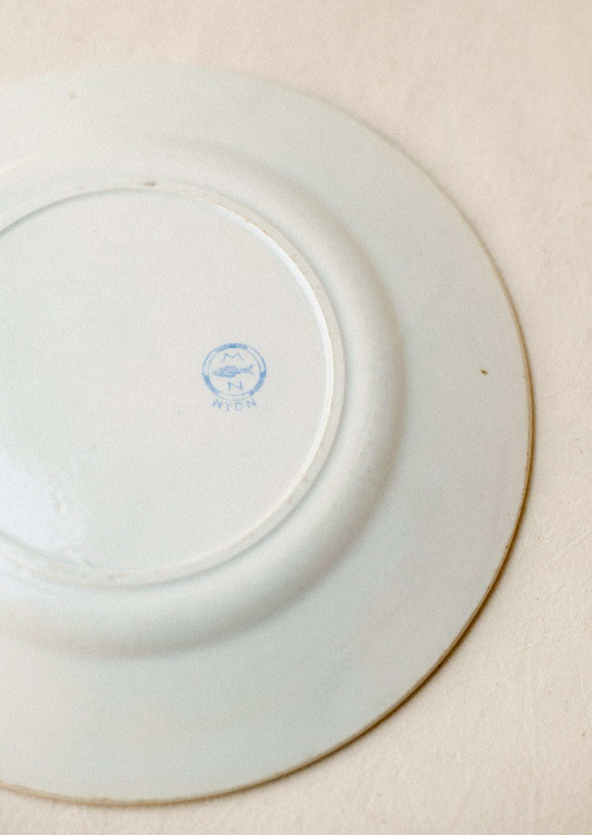 Blue fish maker's mark on back of plate.
