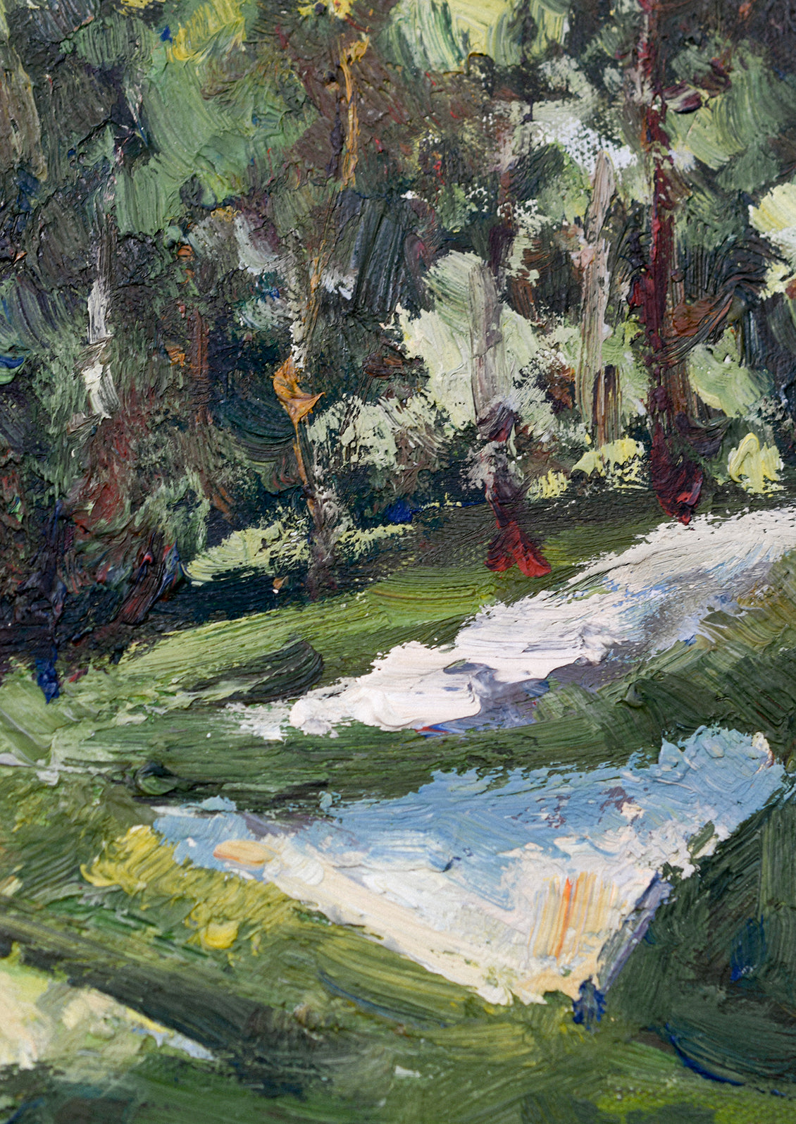 A framed original oil painting of a hilly countryside setting.