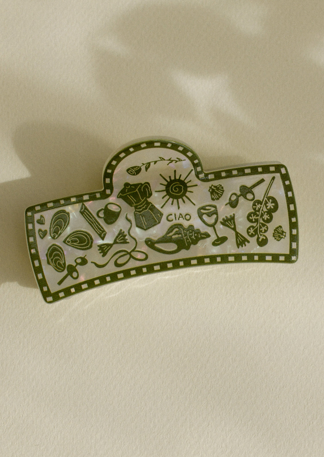 A hair claw with green vacation print.