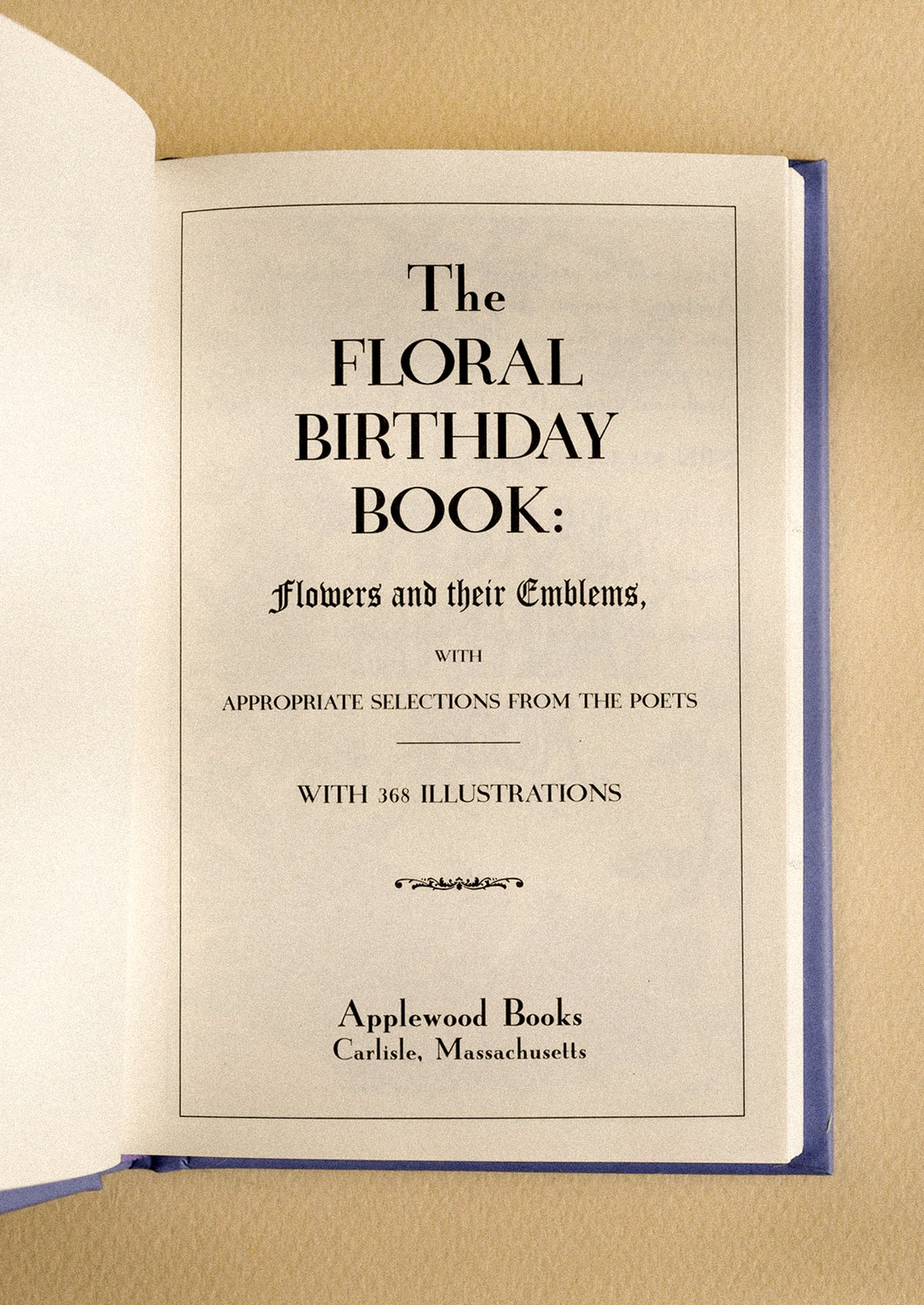 A small book titled "The Floral Birthday Book".