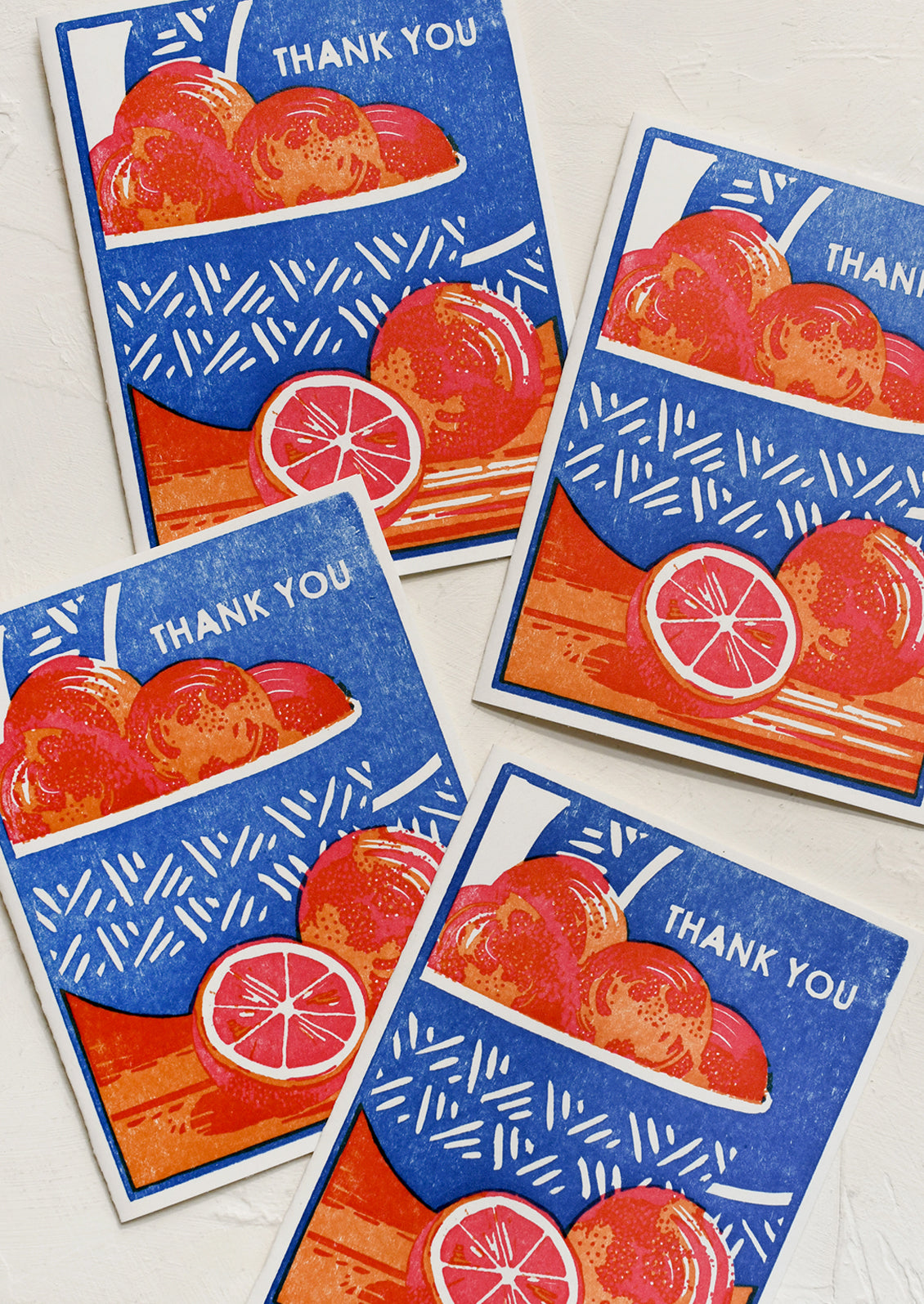 A set of woodcut stamped greeting cards, with image of bowl of oranges and text reading "Thank you".