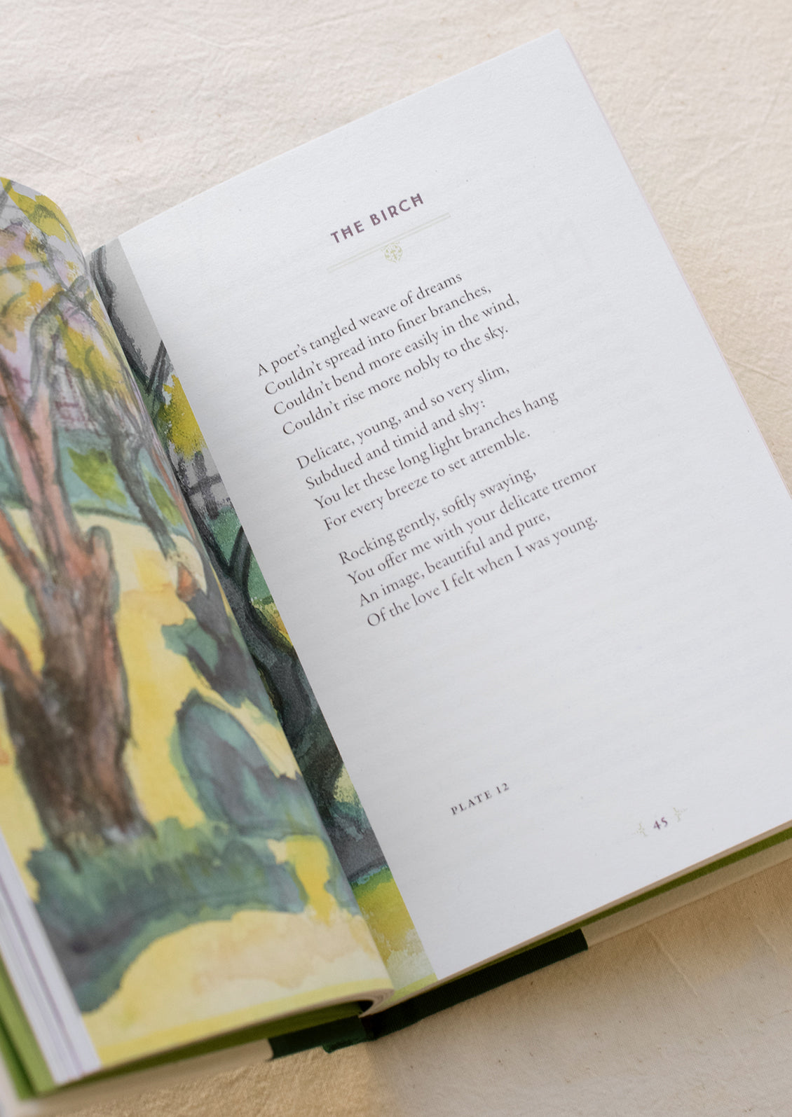 Interior pages with illustration of trees and a poem.