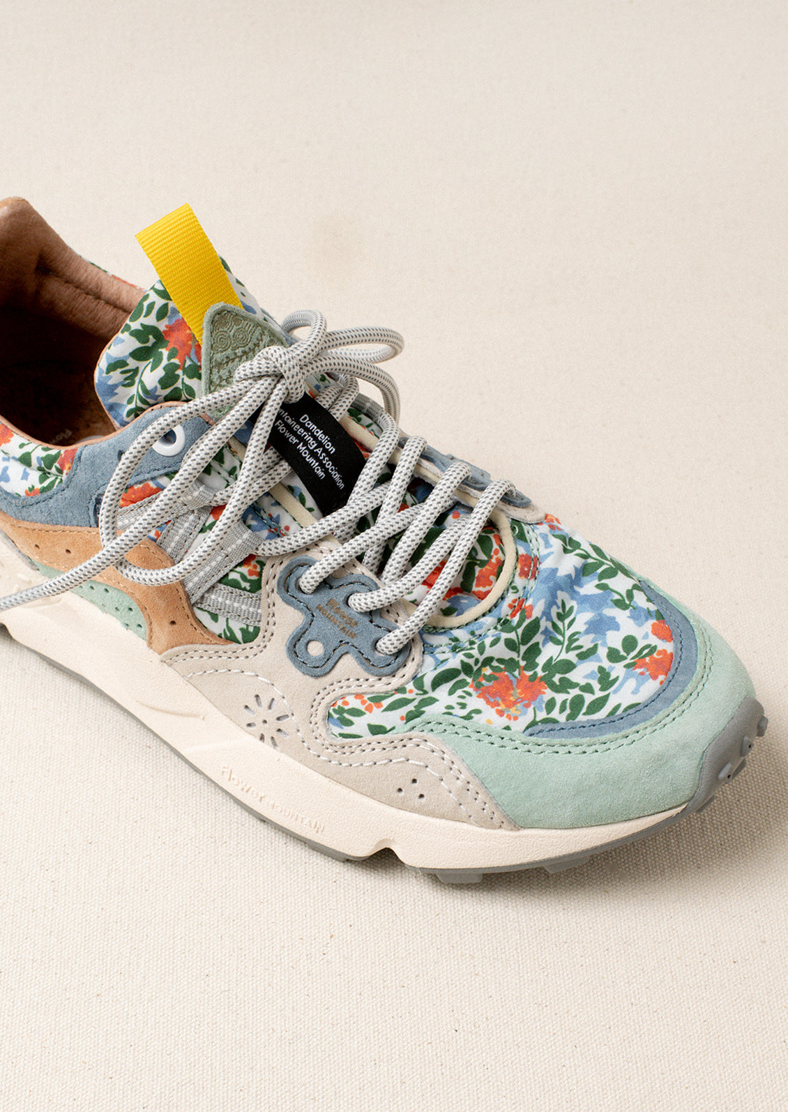 A pair of sneakers with floral print upper.