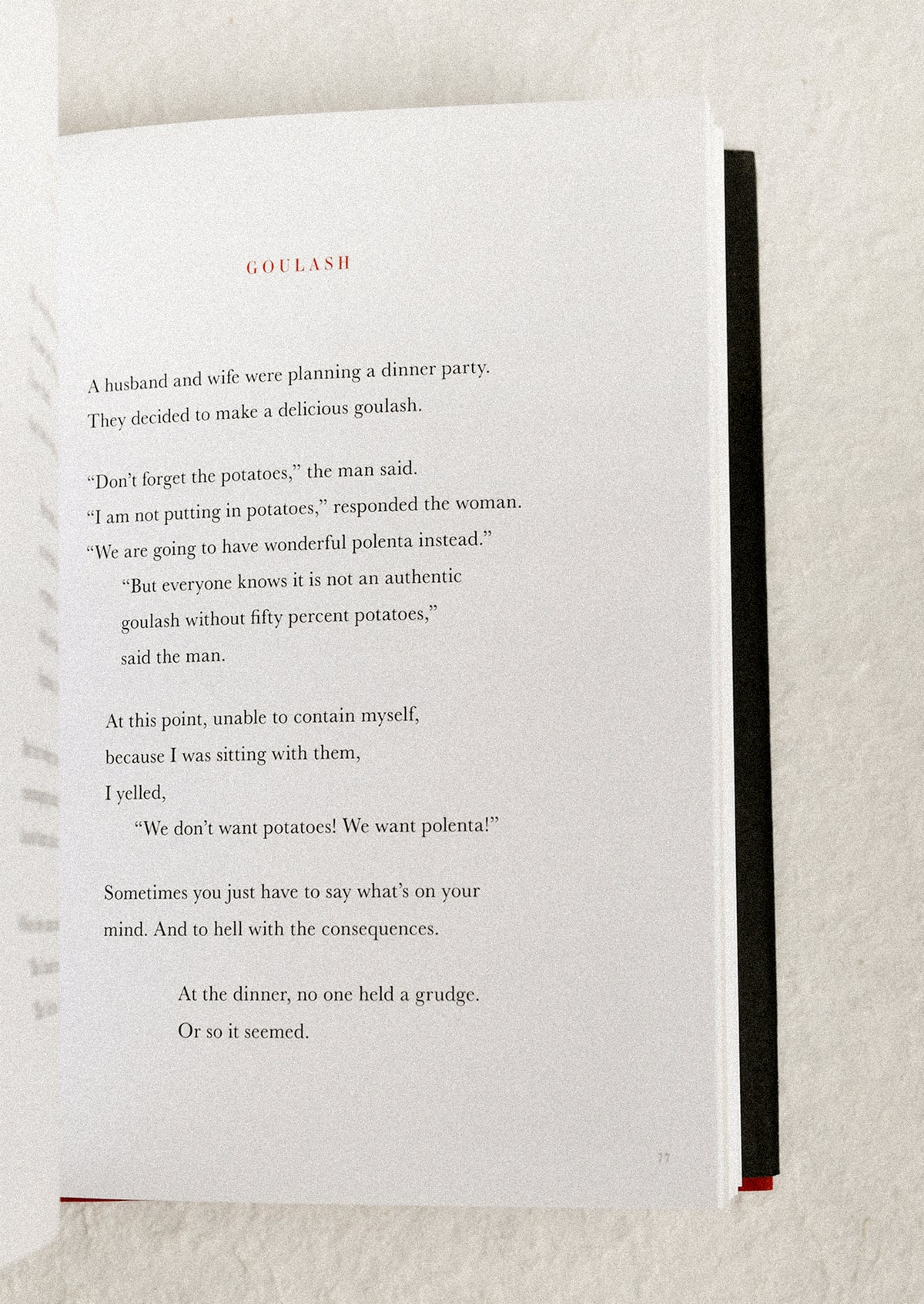 Open book with a humorous story on a textured surface