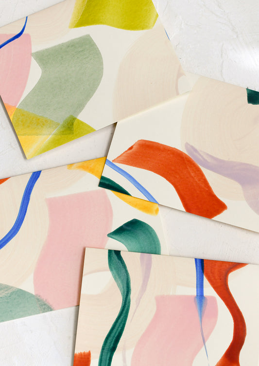 A set of blank greeting cards with colorful abstract pattern on front.