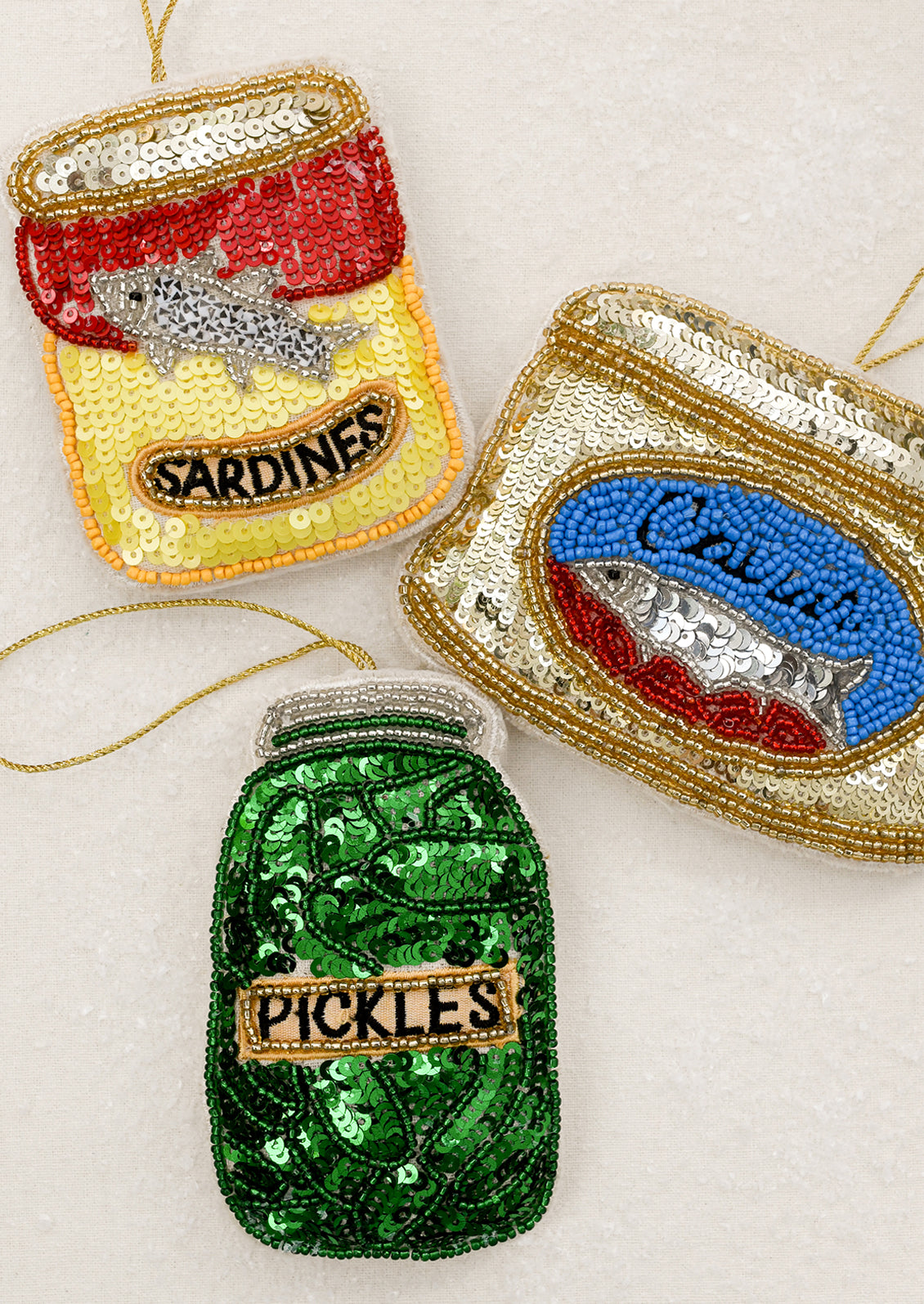 Soft sequin embellished ornaments depicting various canned/jarred foods.