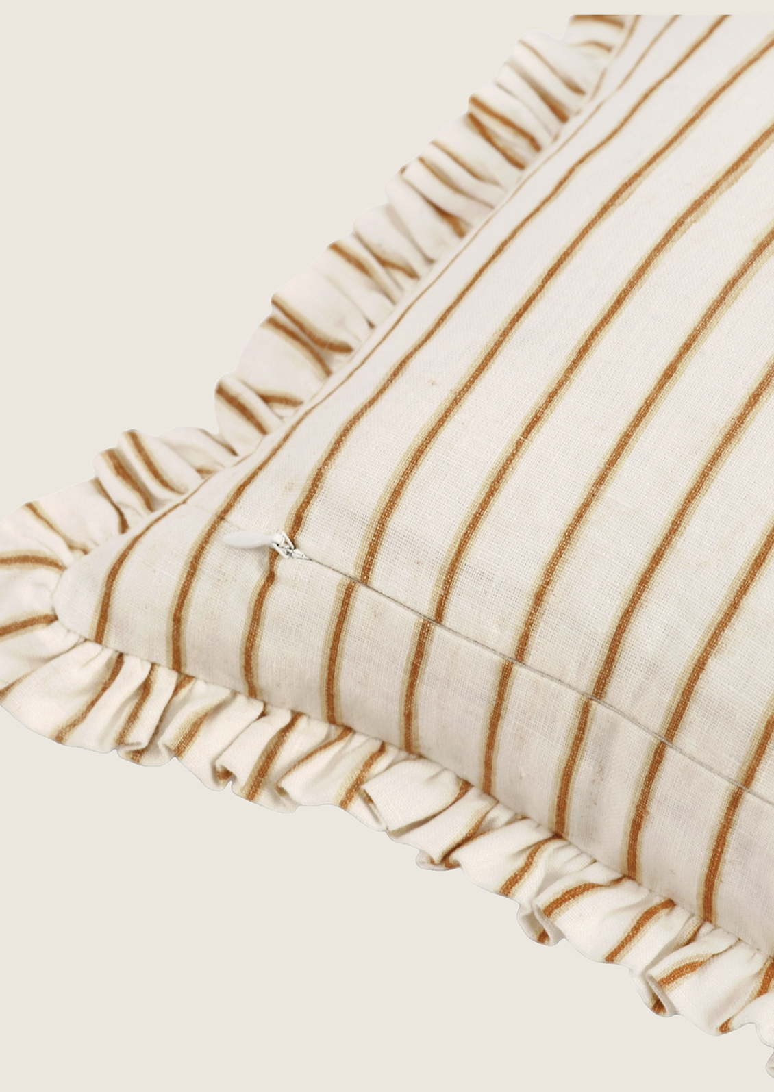 Close-up of a textured fabric with brown stripes and ruffled edges on a light background