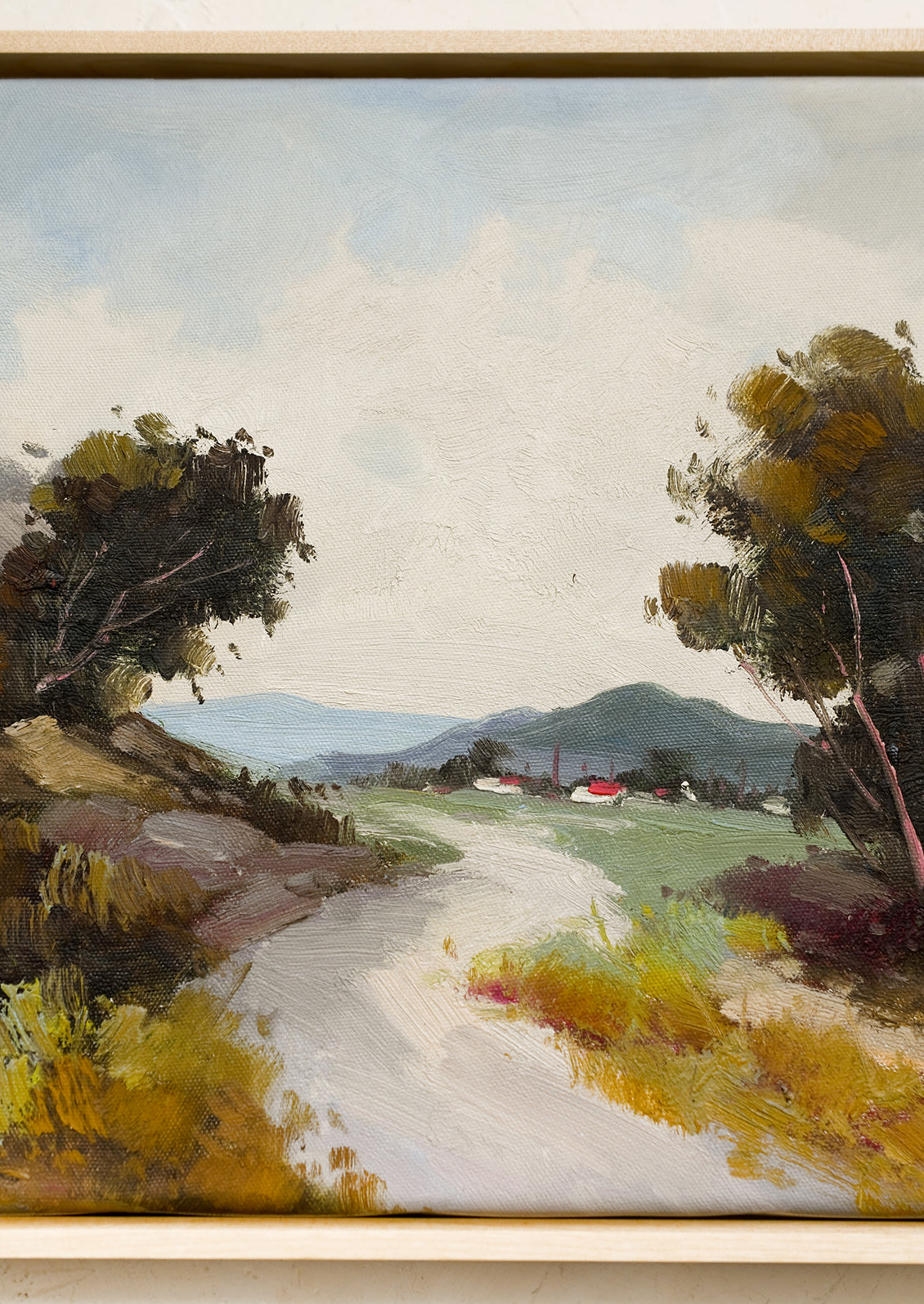 An original landscape oil painting depicting a path between trees.