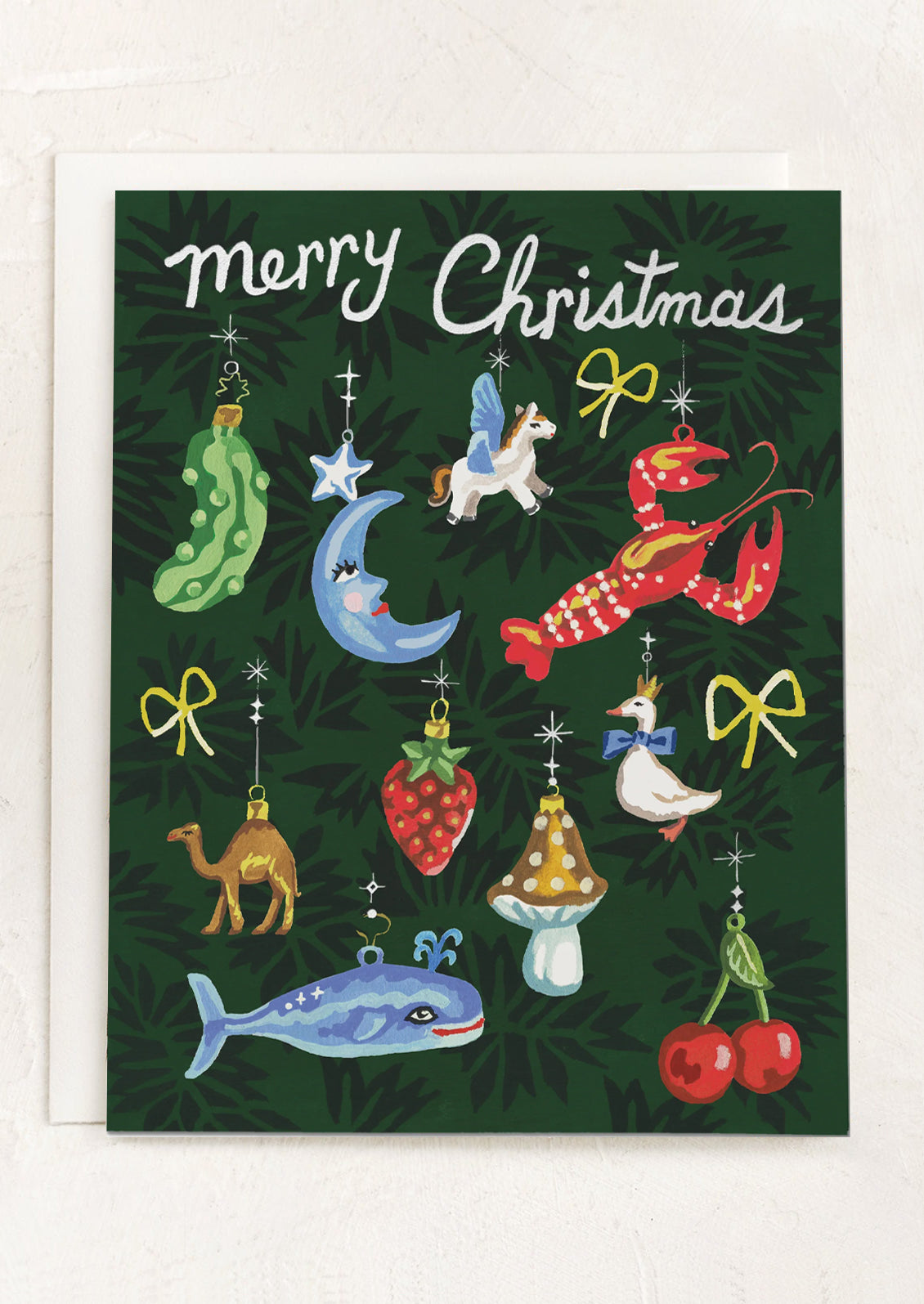 A greeting card with imagery of antique style ornaments, text at top reads "Merry Christmas".