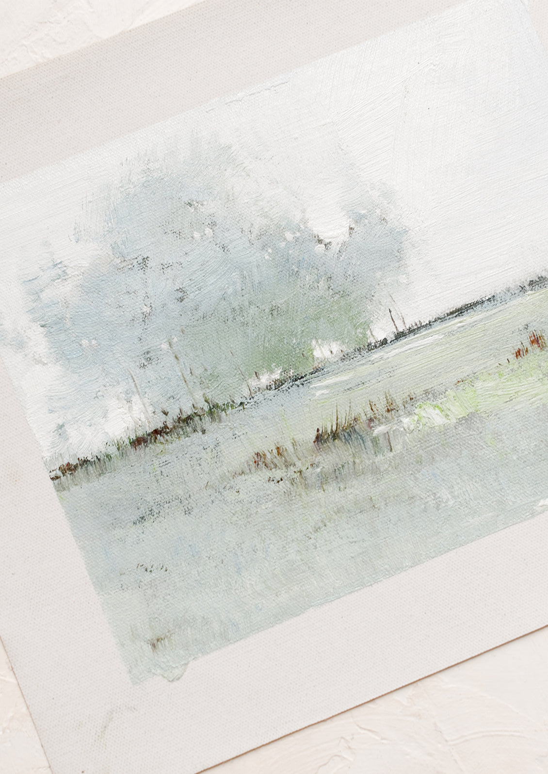 An original oil painting on unstretched canvas of a landscape.