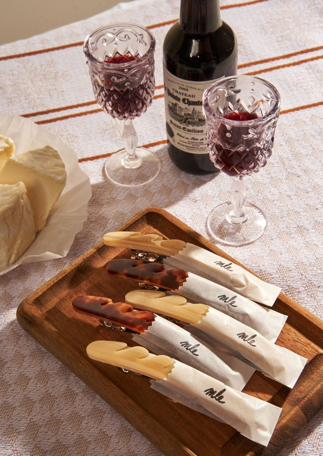 Baguette hair clips on a table setting.