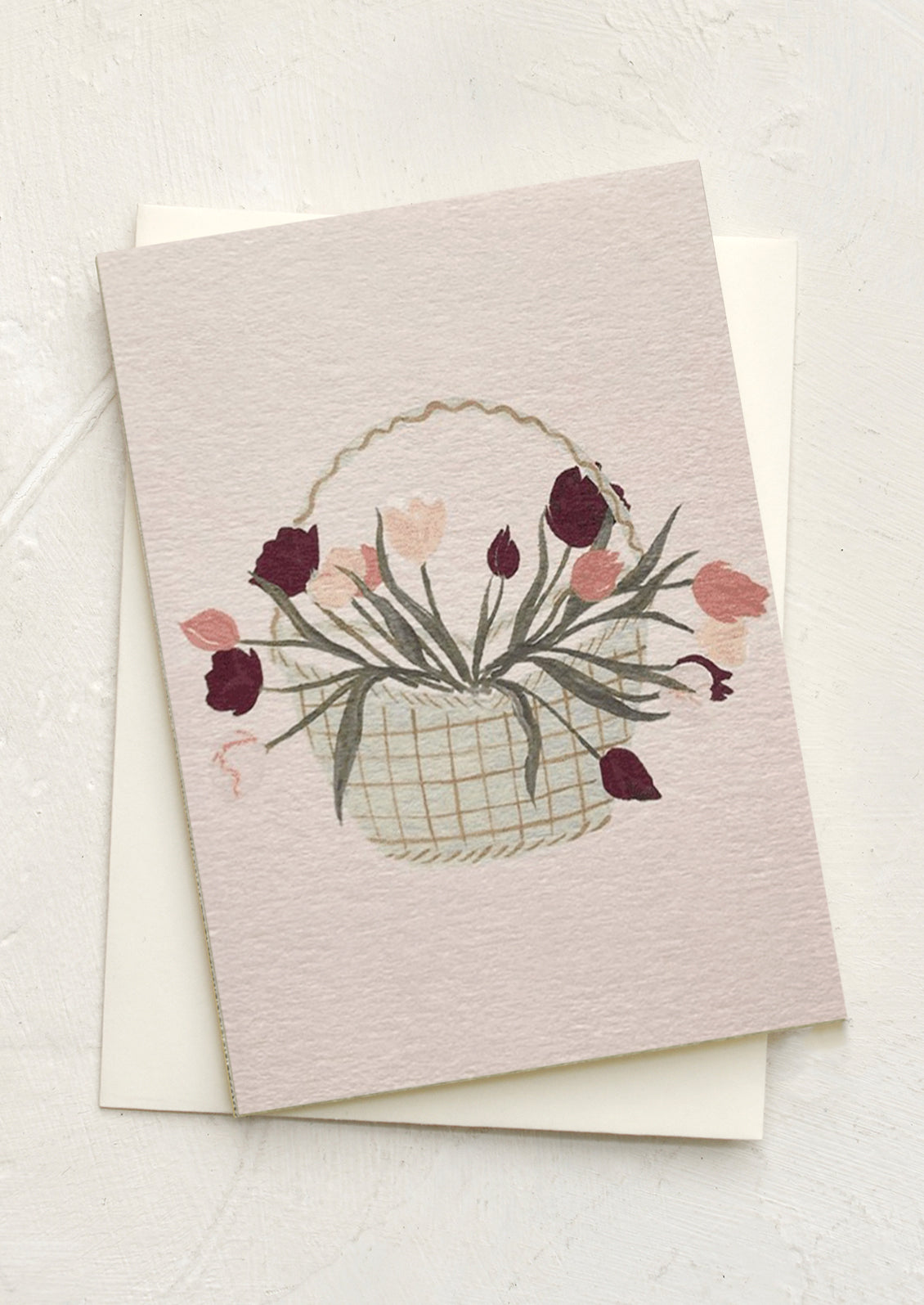 A mini greeting card in mauve with illustration of tulips in basket.