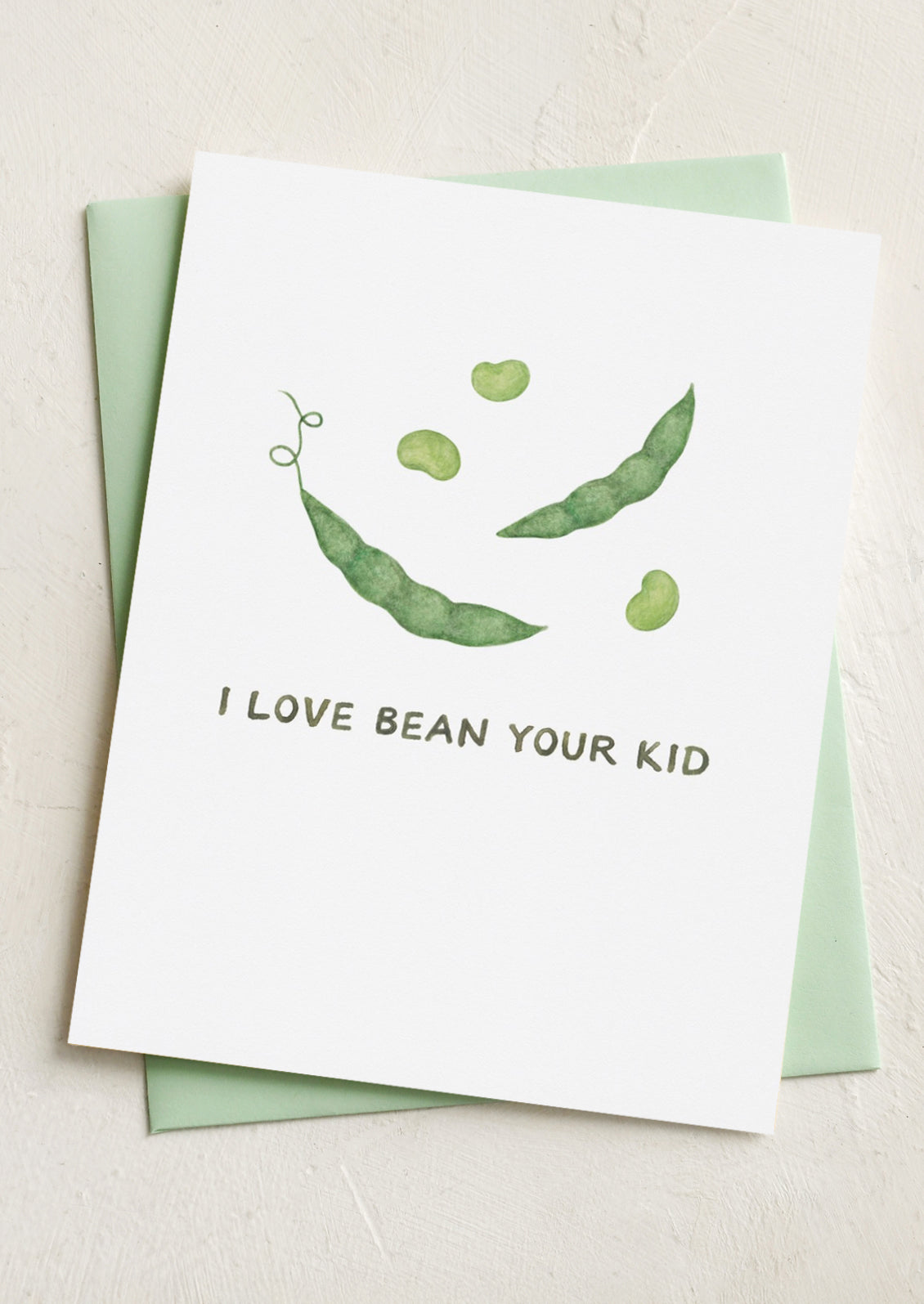 A card with illustration of green beans, text reads "I love bean your kid".