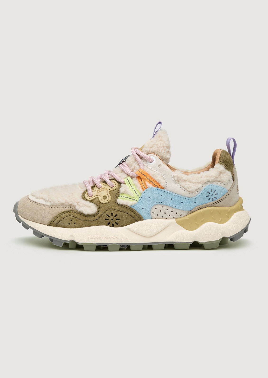 A pair of sporty sneakers in pastel multicolor with cream shearling upper.