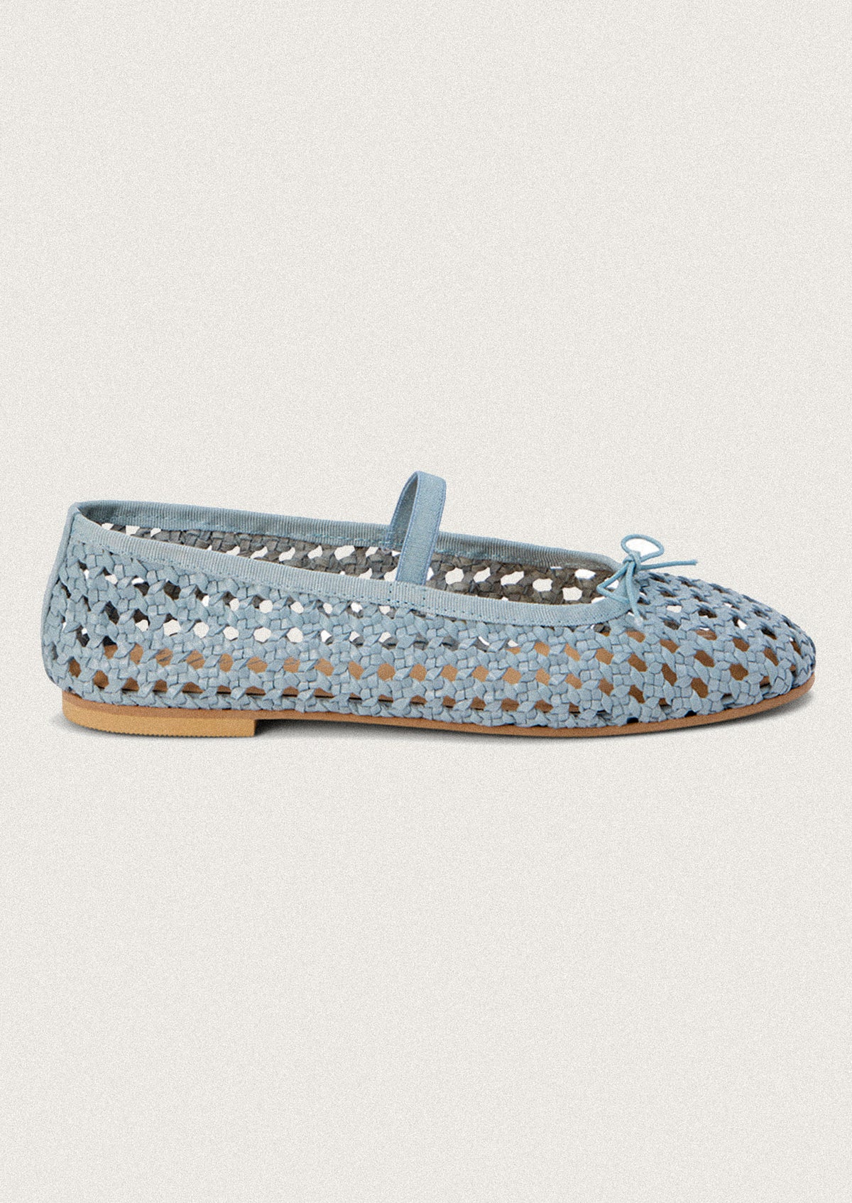 A pair of open weave leather ballet flats in powder blue.