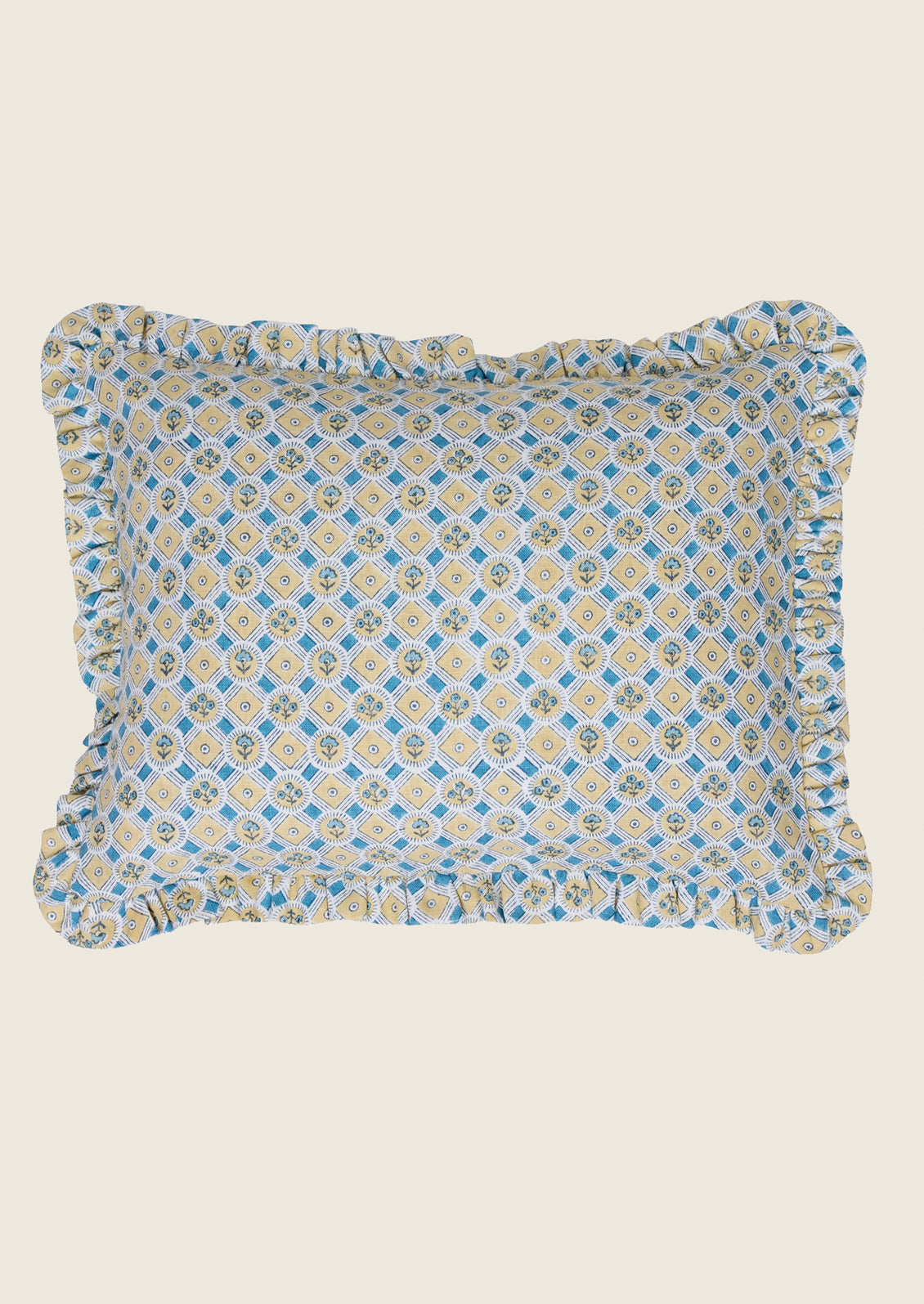 Decorative pillow with blue and yellow pattern on a beige background