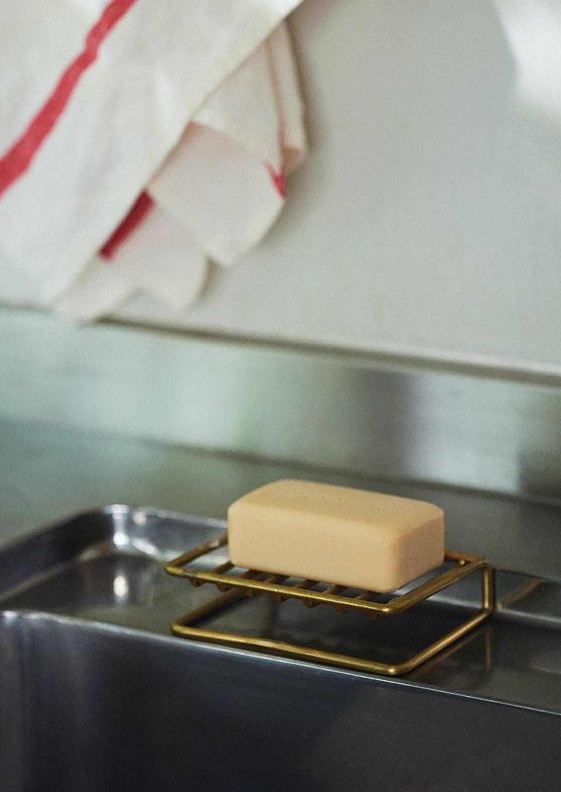 A wire brass soap stand.