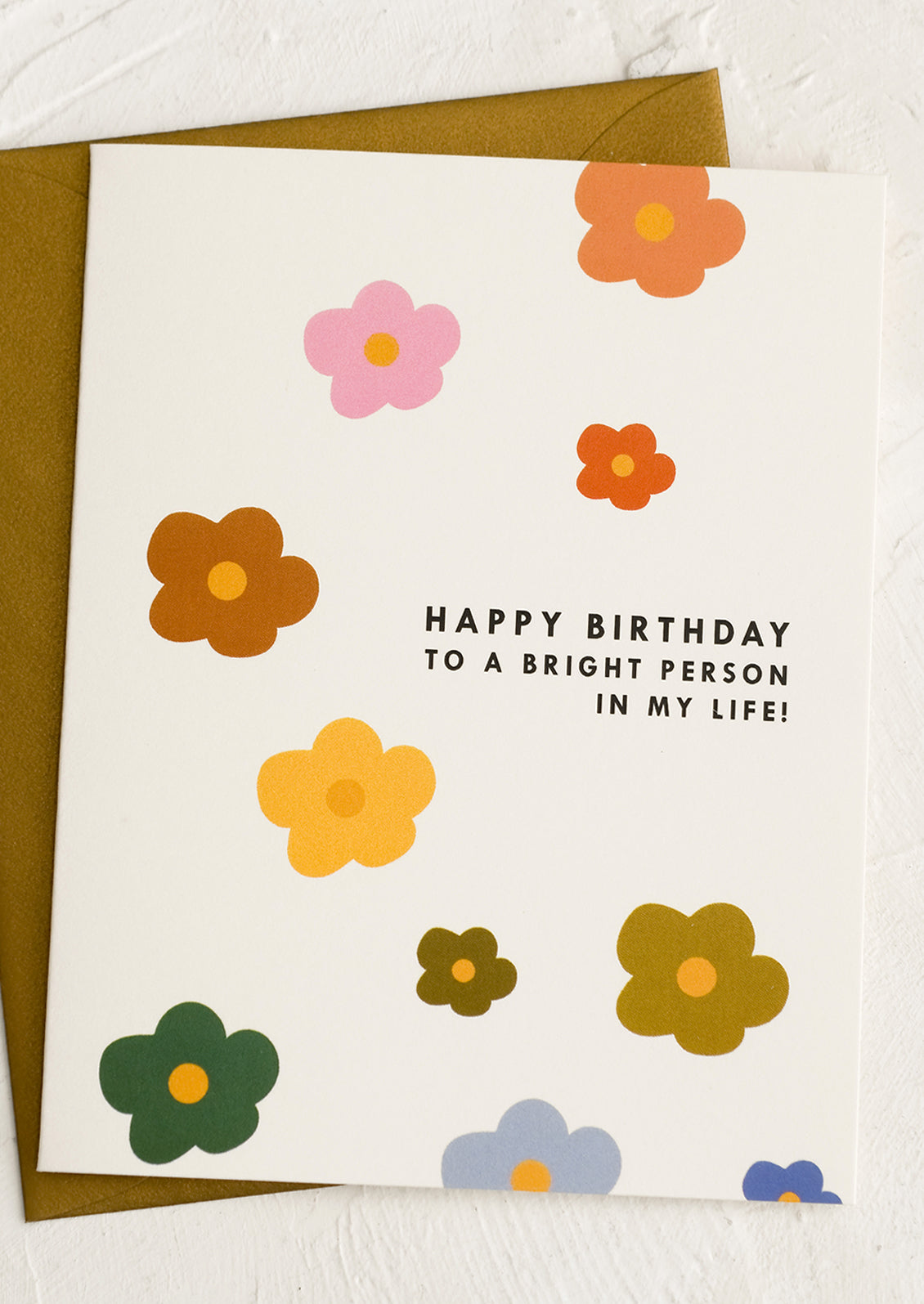 A rainbow colored card reading "Happy Birthday To A Bright Person in My Life!".