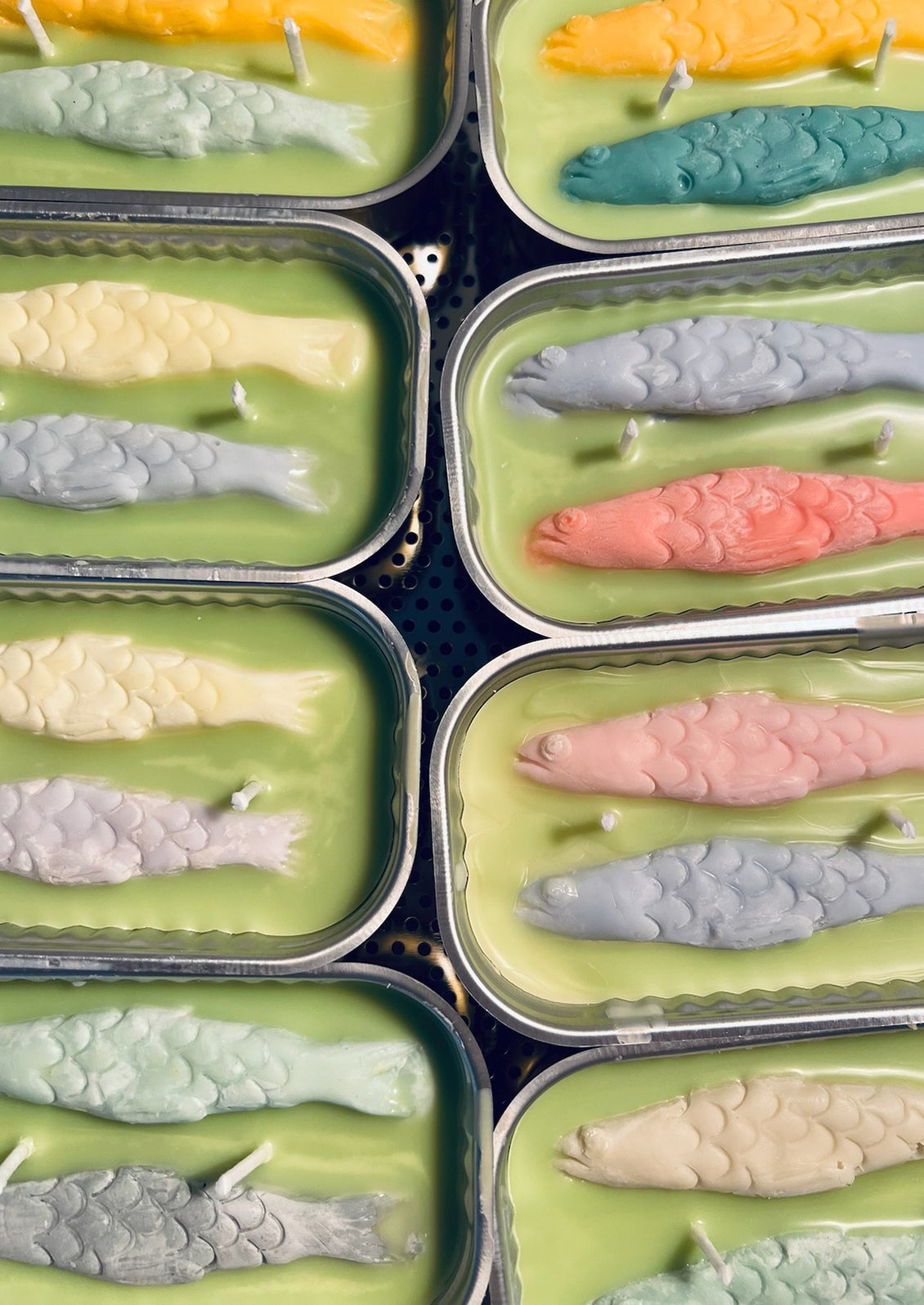 Multicolor tin of sardine candles.