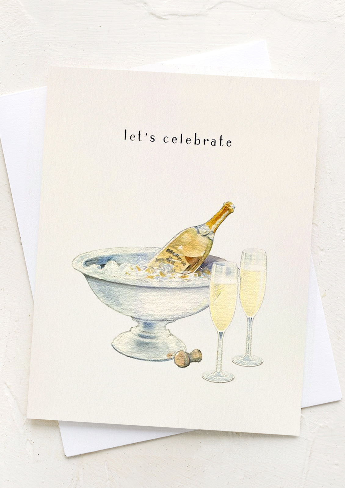 A card with image of champagne in ice bucket, text reads "Let's celebrate".