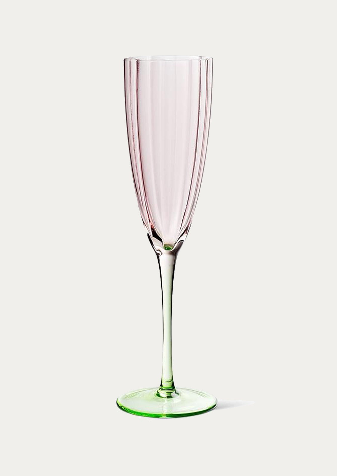 A champagne glass in the shape of a tulip.