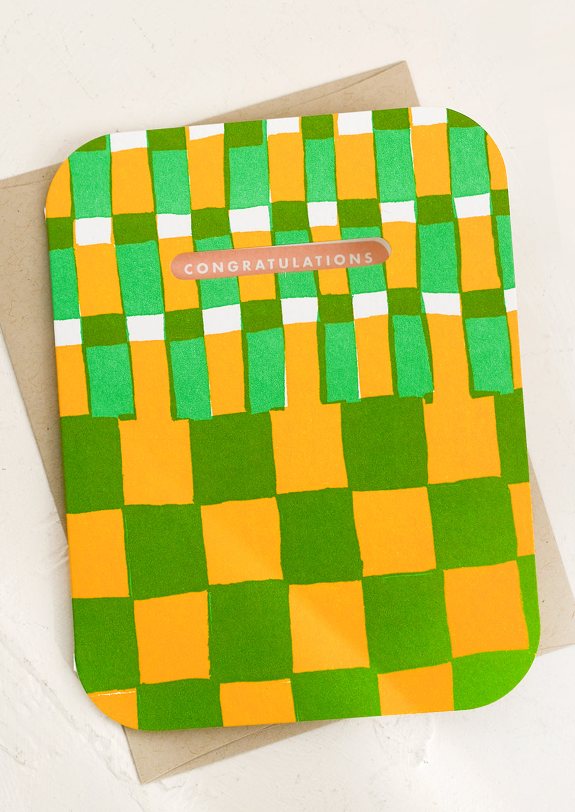 A checkboard print card in yellow and green reading "Congratulations!'.
