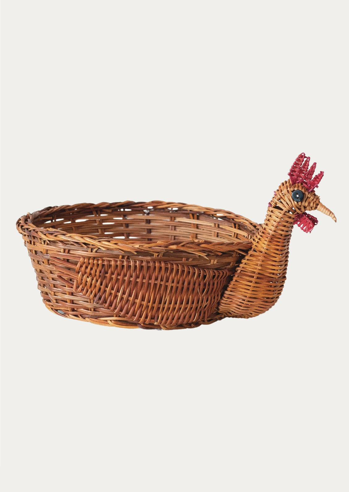 A woven basket with three dimensional chicken head detailing on side.