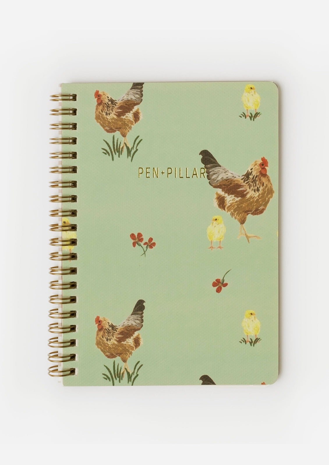A spiral bound notebook with green chicken print.