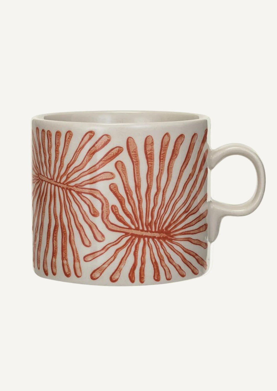 A white ceramic mug with coral seaweed pattern.