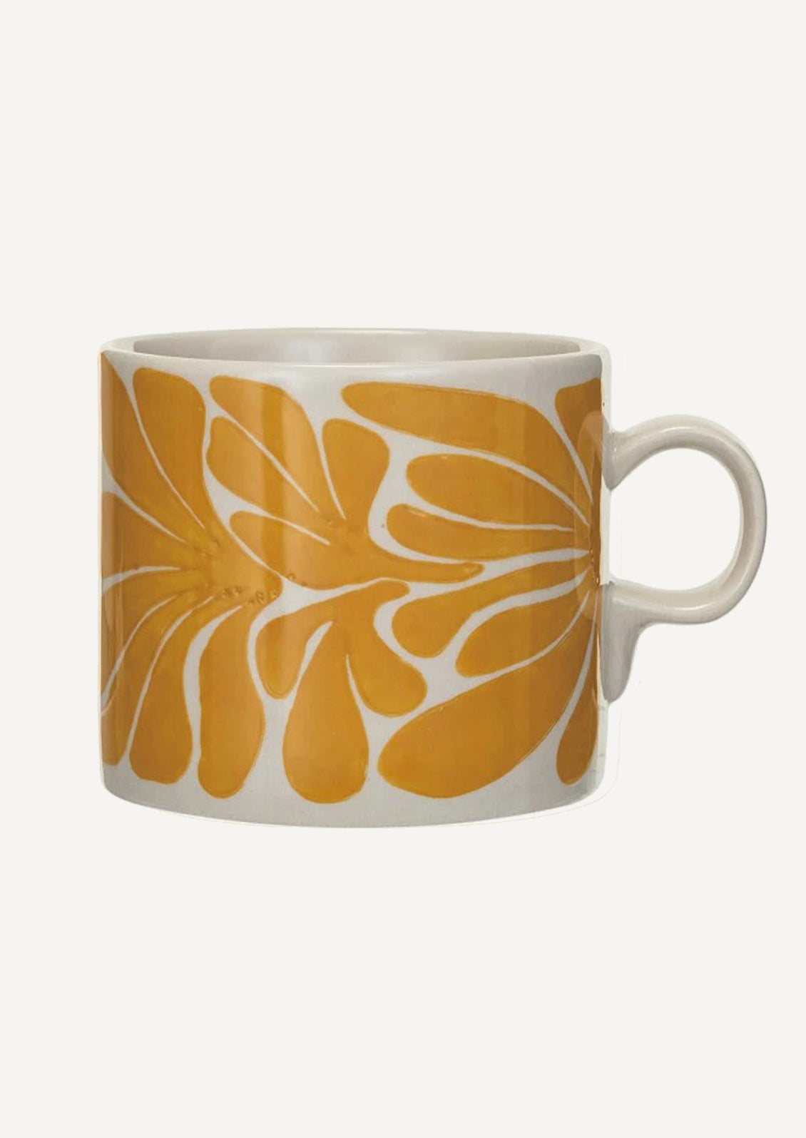 A white ceramic mug with yellow seaweed pattern.