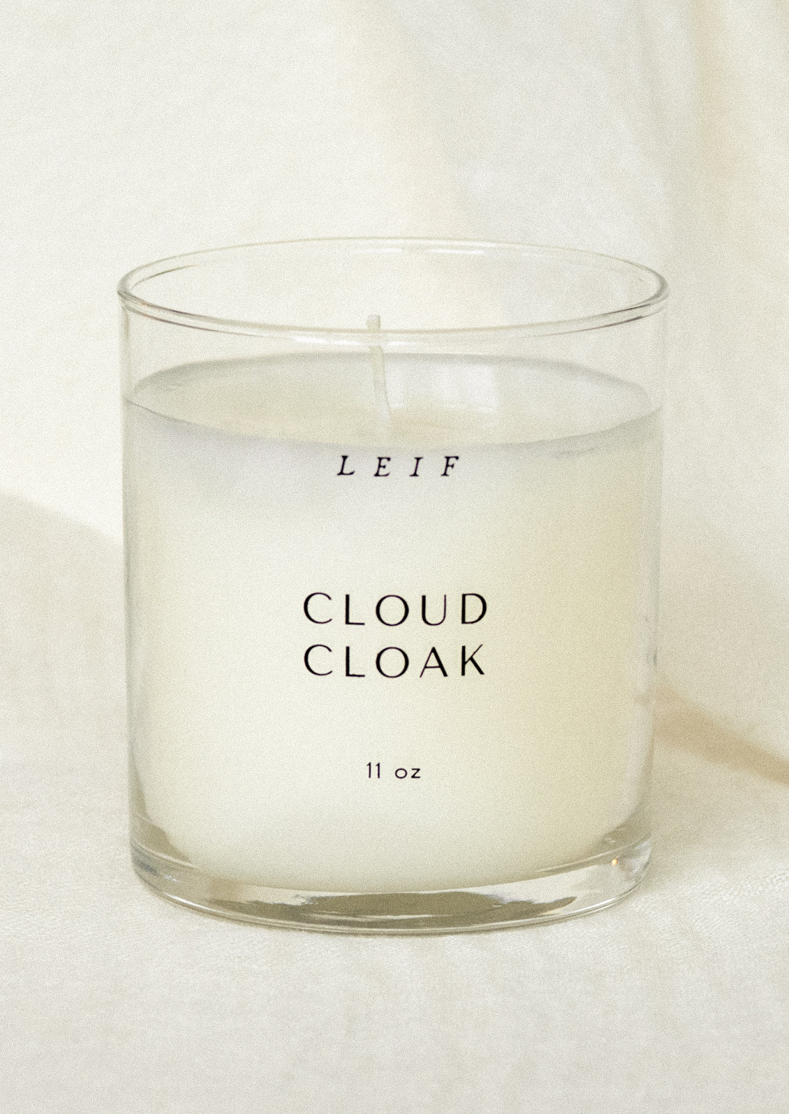 A jar candle in cloud cloak scent.