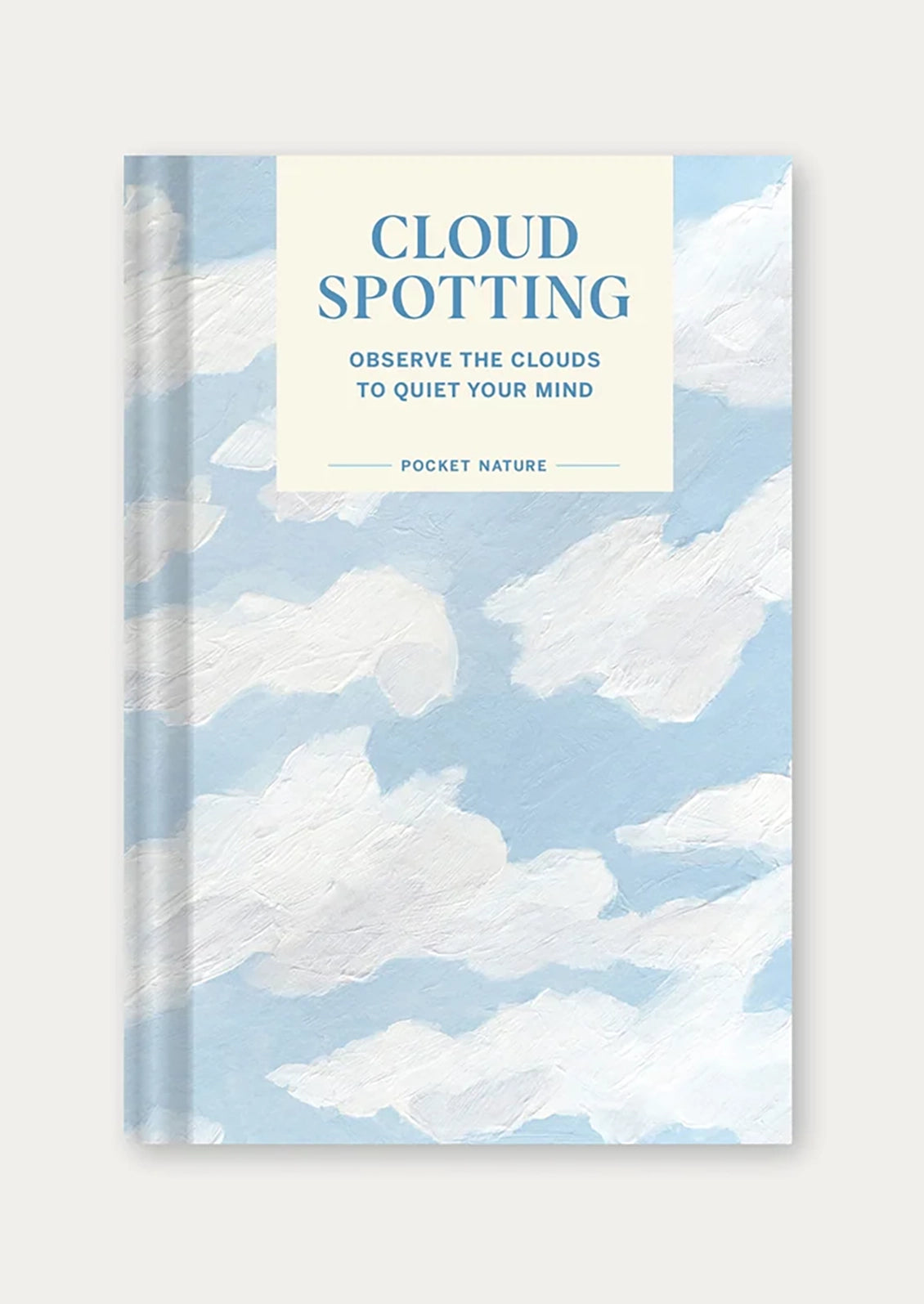 A book titled "Cloud Spotting" with an image of painted white clouds on the cover.