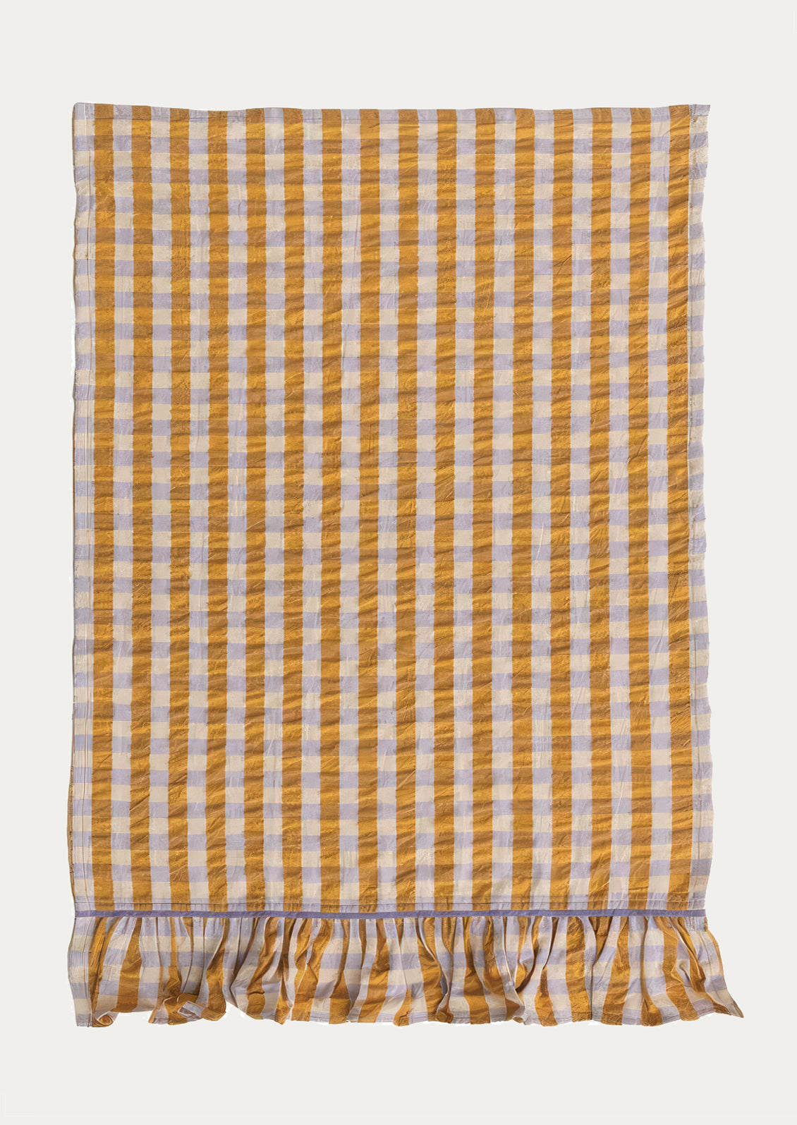 A two-tone gingham tea towel in orange and lavender with ruffle trim on bottom.