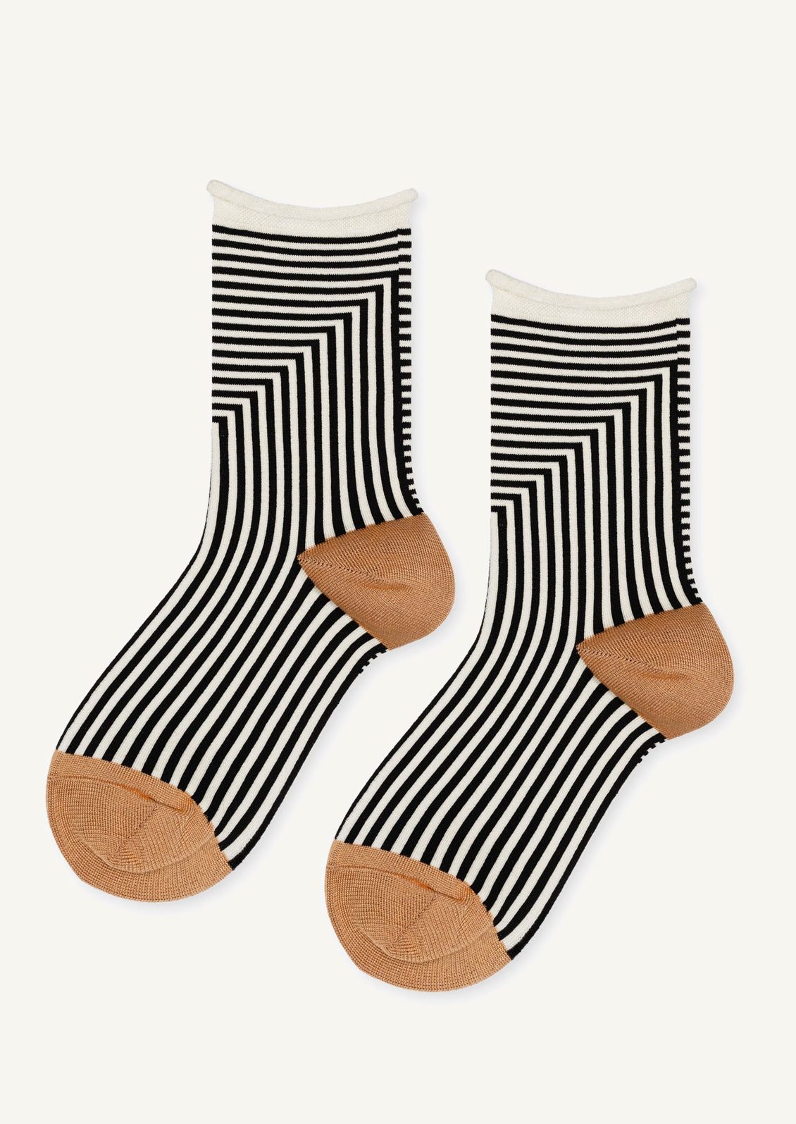 Black and white geo stripe socks with camel colored contrast.